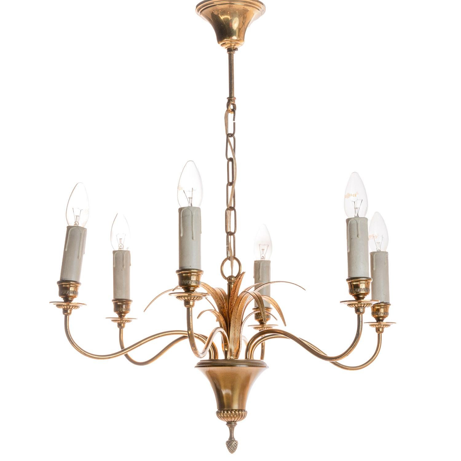 Wonderfull iconic palm chandelier of gilted brass. It holds 6 E14 lightbulbs.