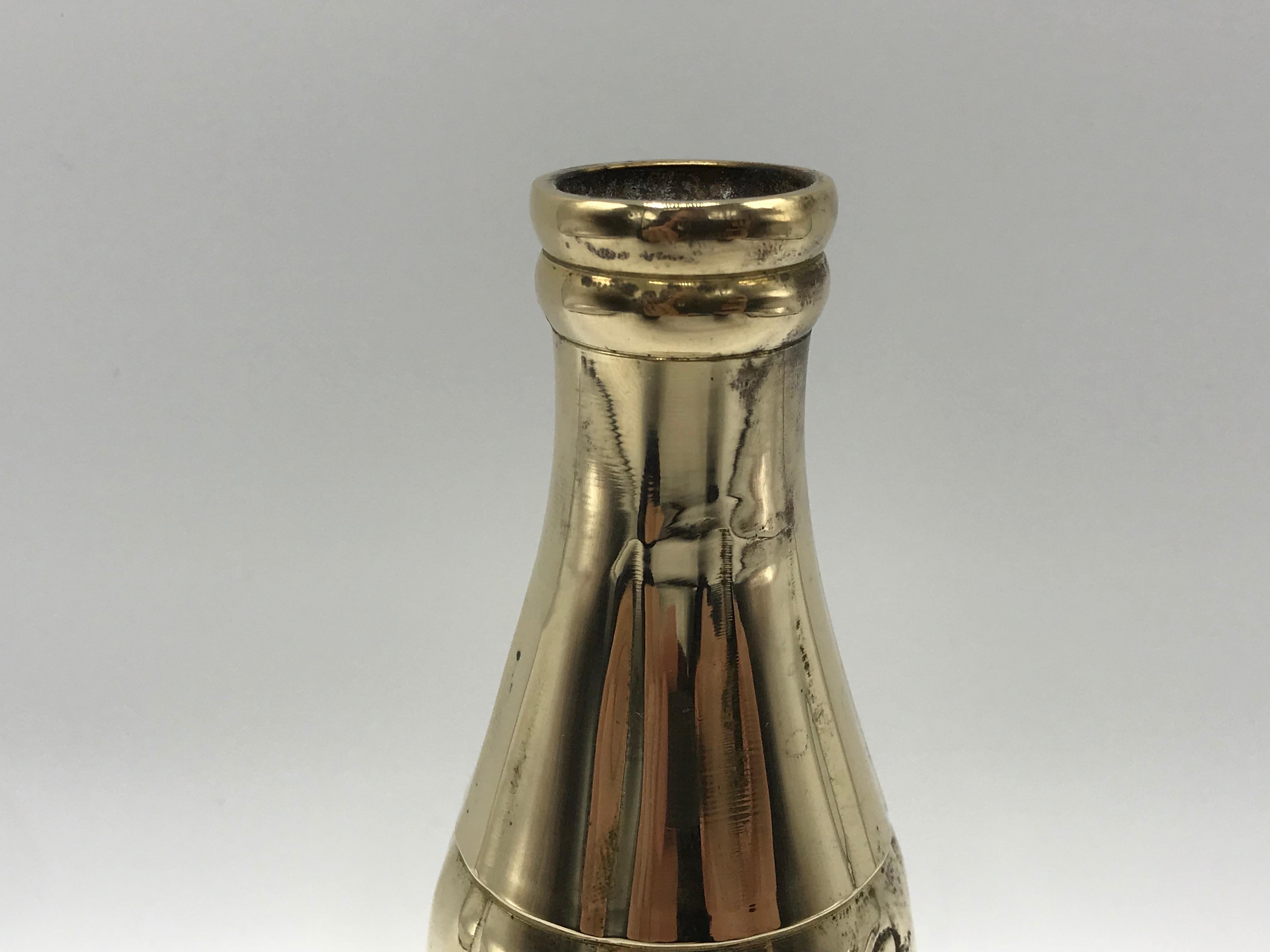 Offered is a 1970s polished-brass Coca-Cola bottle sculpture. The novelty piece has been crafted to replicate the vintage coke glass bottles.
