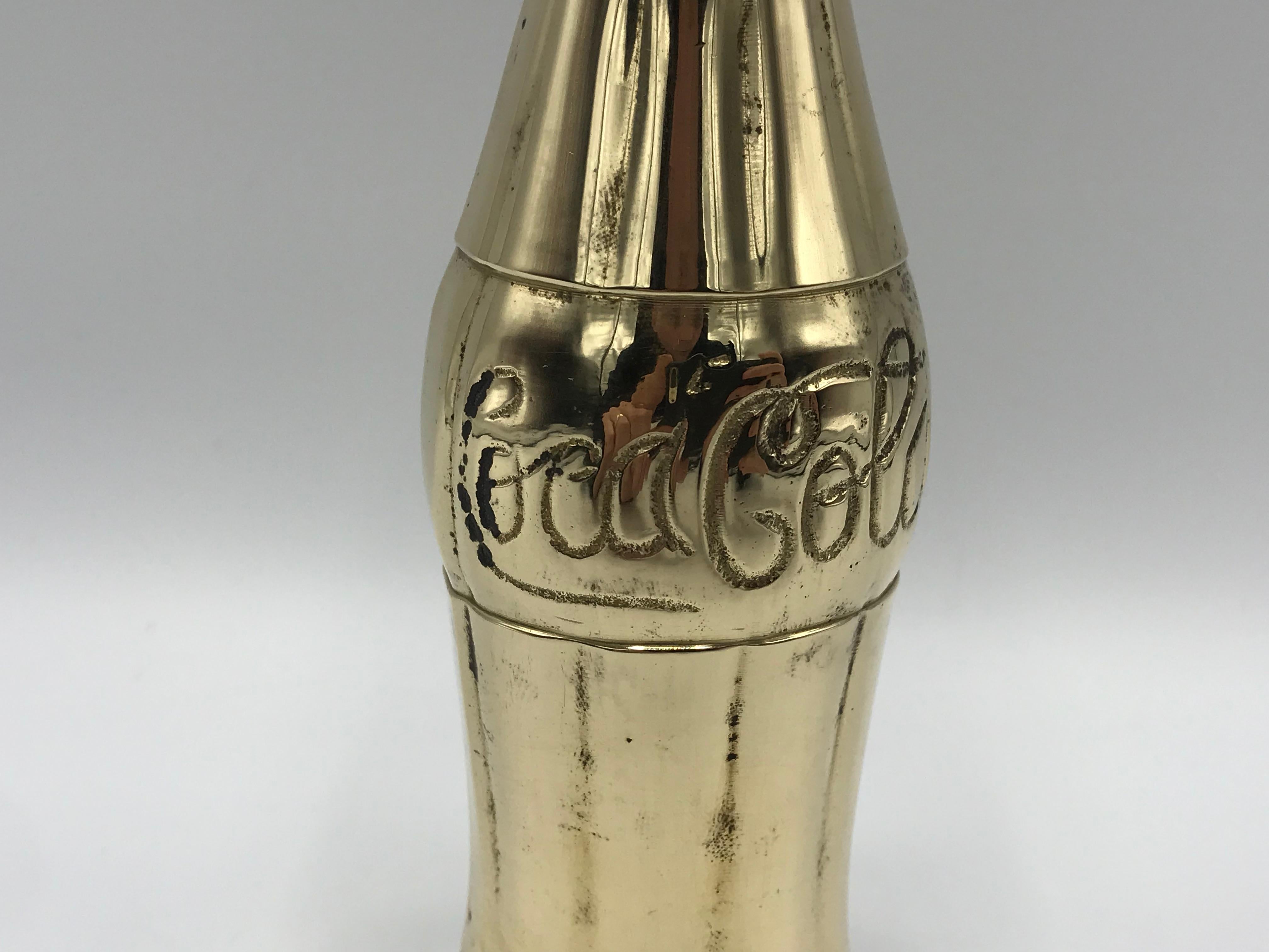 brass coca cola bottle