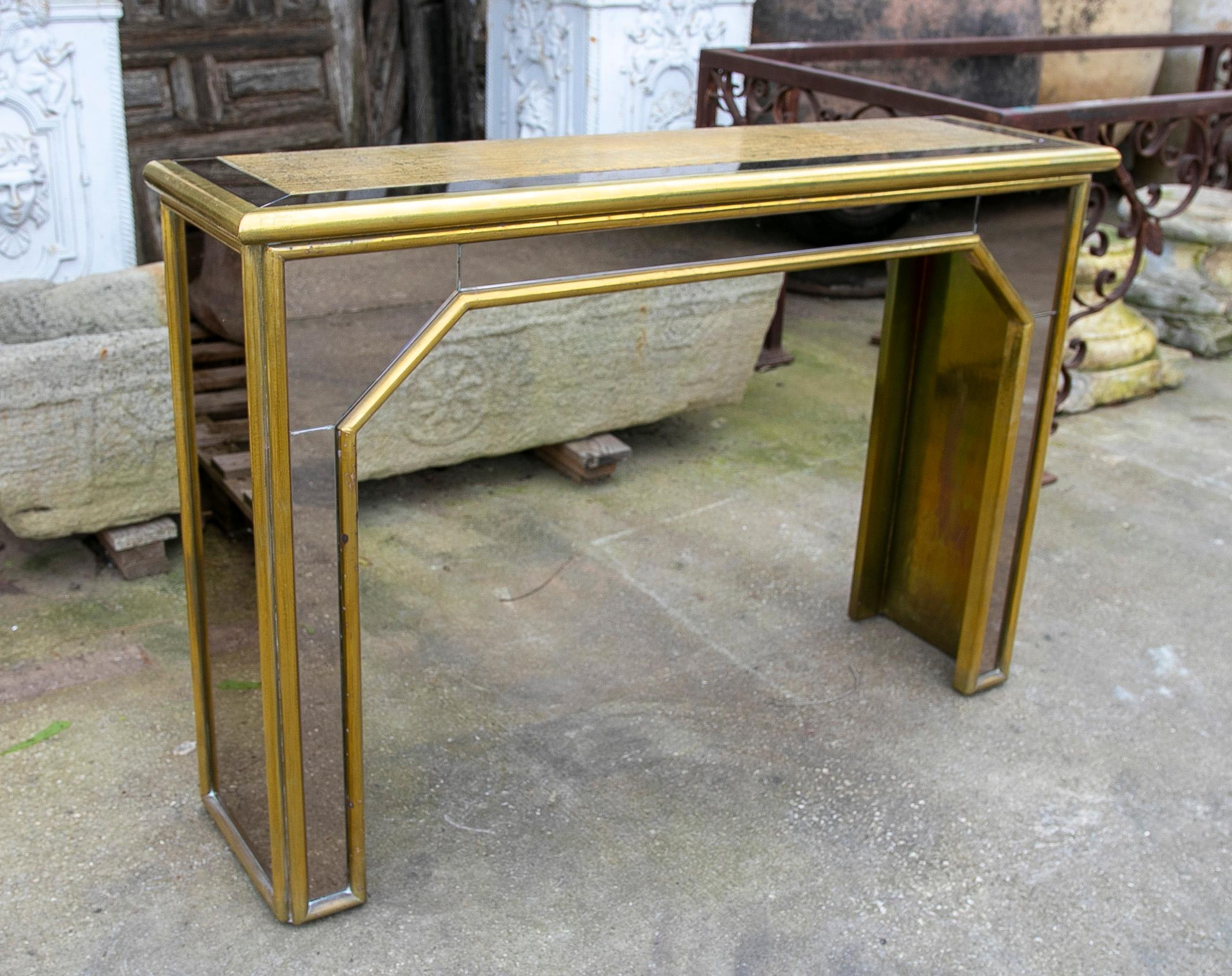 1970s Brass console with mirror signed by the artist Gony Nava.