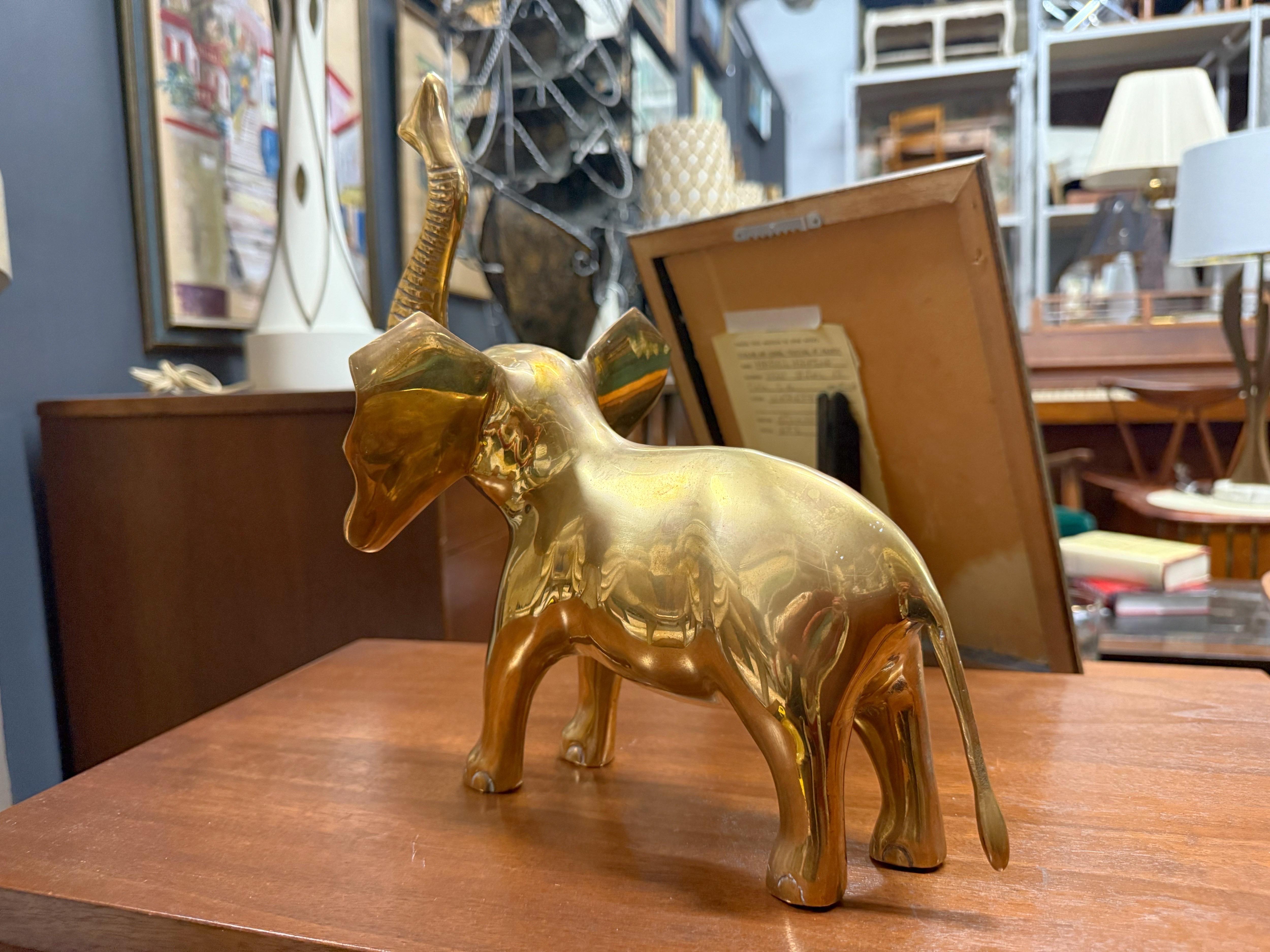 Offered is a beautiful, large, 1970s brass elephant sculpture. This heavily detailed piece is perfect for any brass collector! Heavy, weighing 8.5lbs.   Thoroughly cleaned and polished.