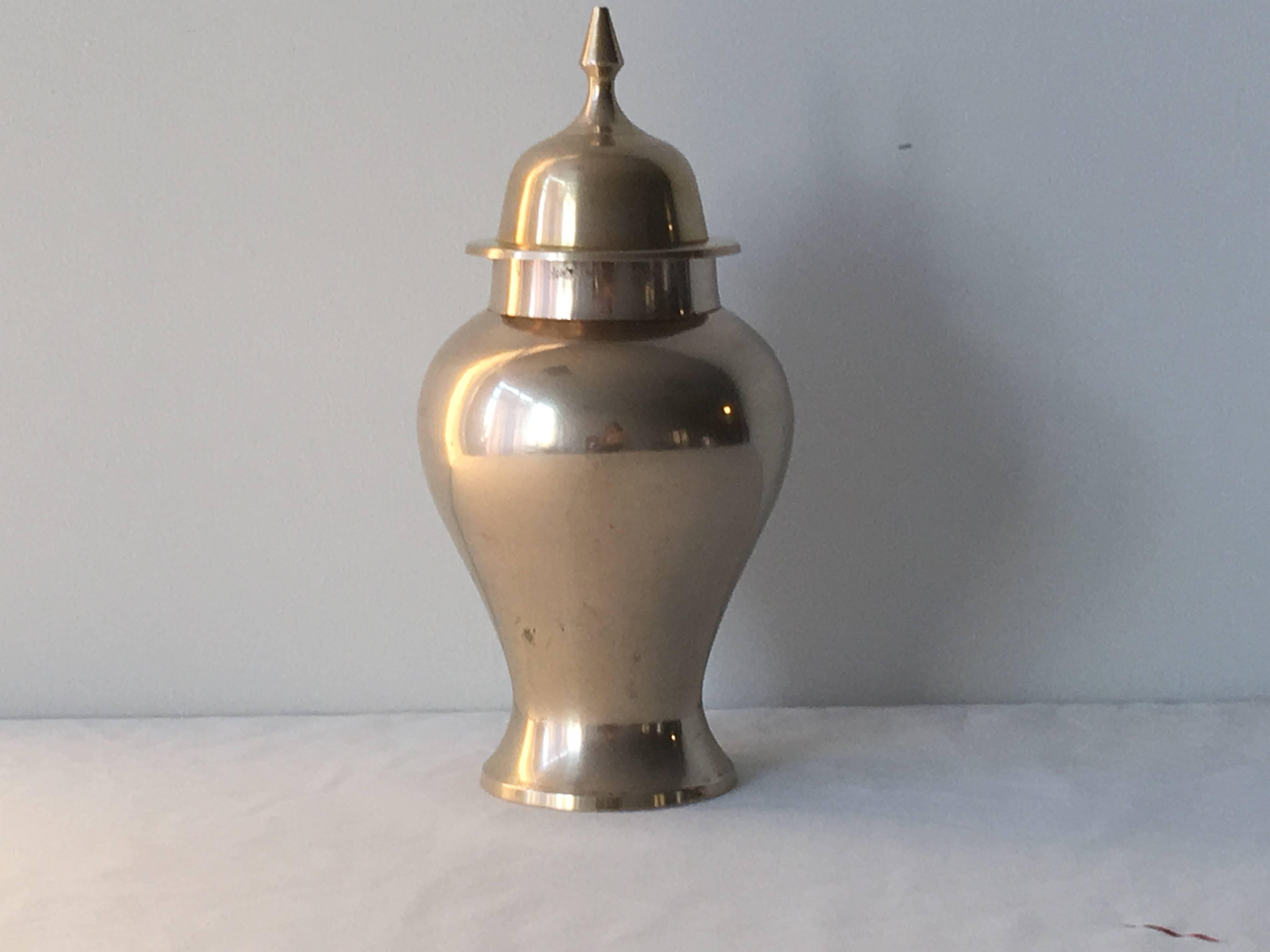Offered is a beautiful, 1970s polished brass ginger jar urn.