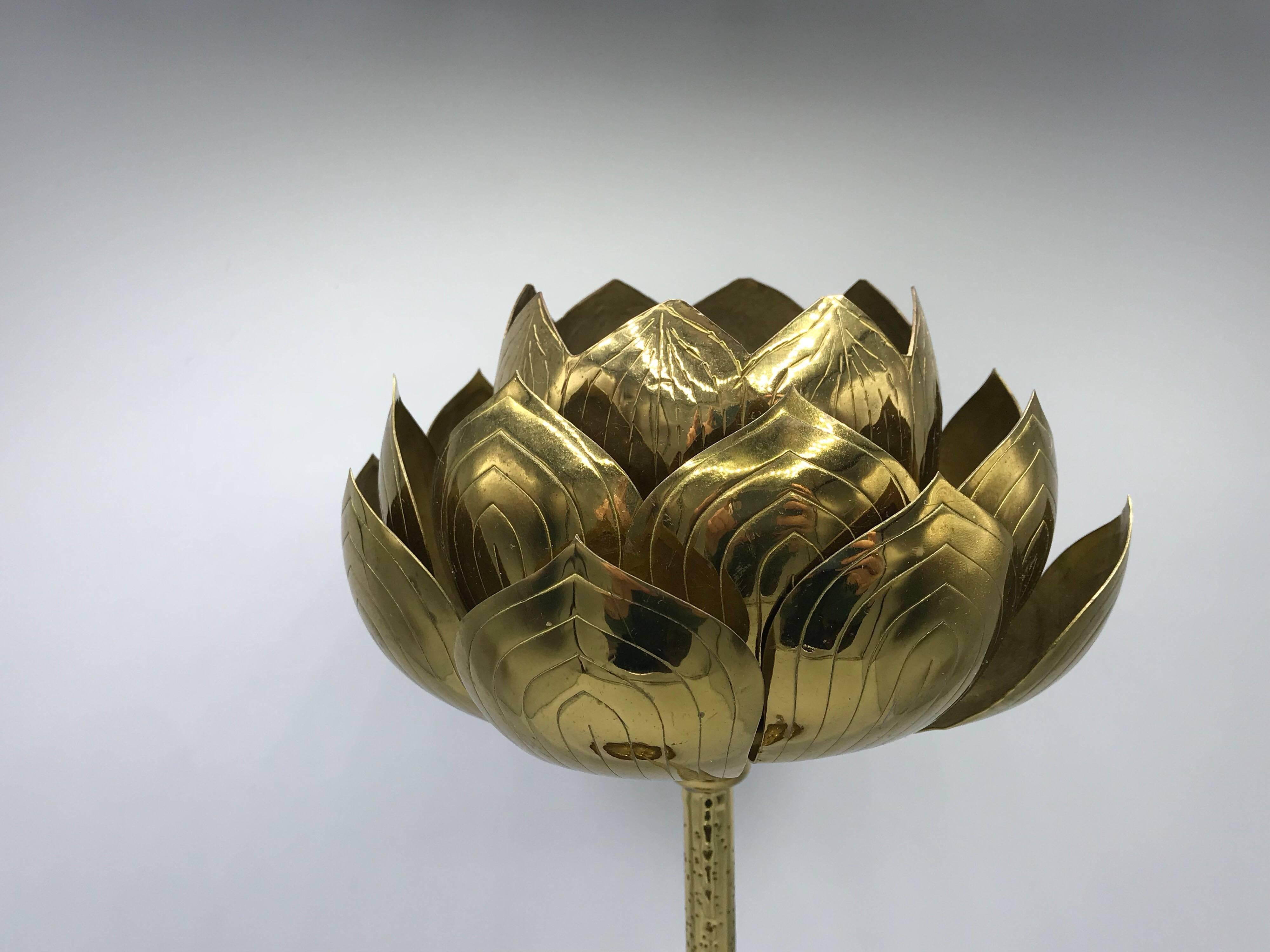 Offered is a glamorous, 1970s brass lotus sculpture candle holder. Beautiful detailing and such a statement piece! Would make a perfect ashtray as well.