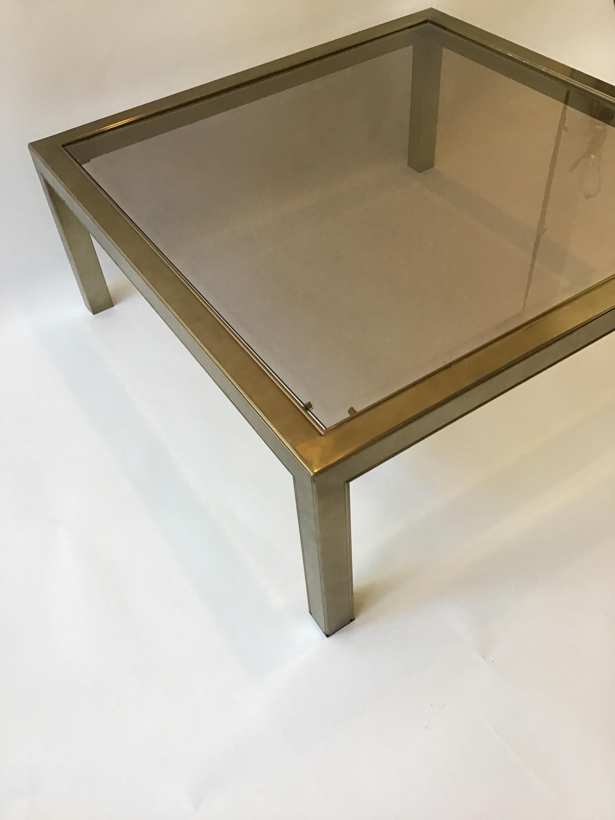 1970s brass plated beveled glass top square coffee table.