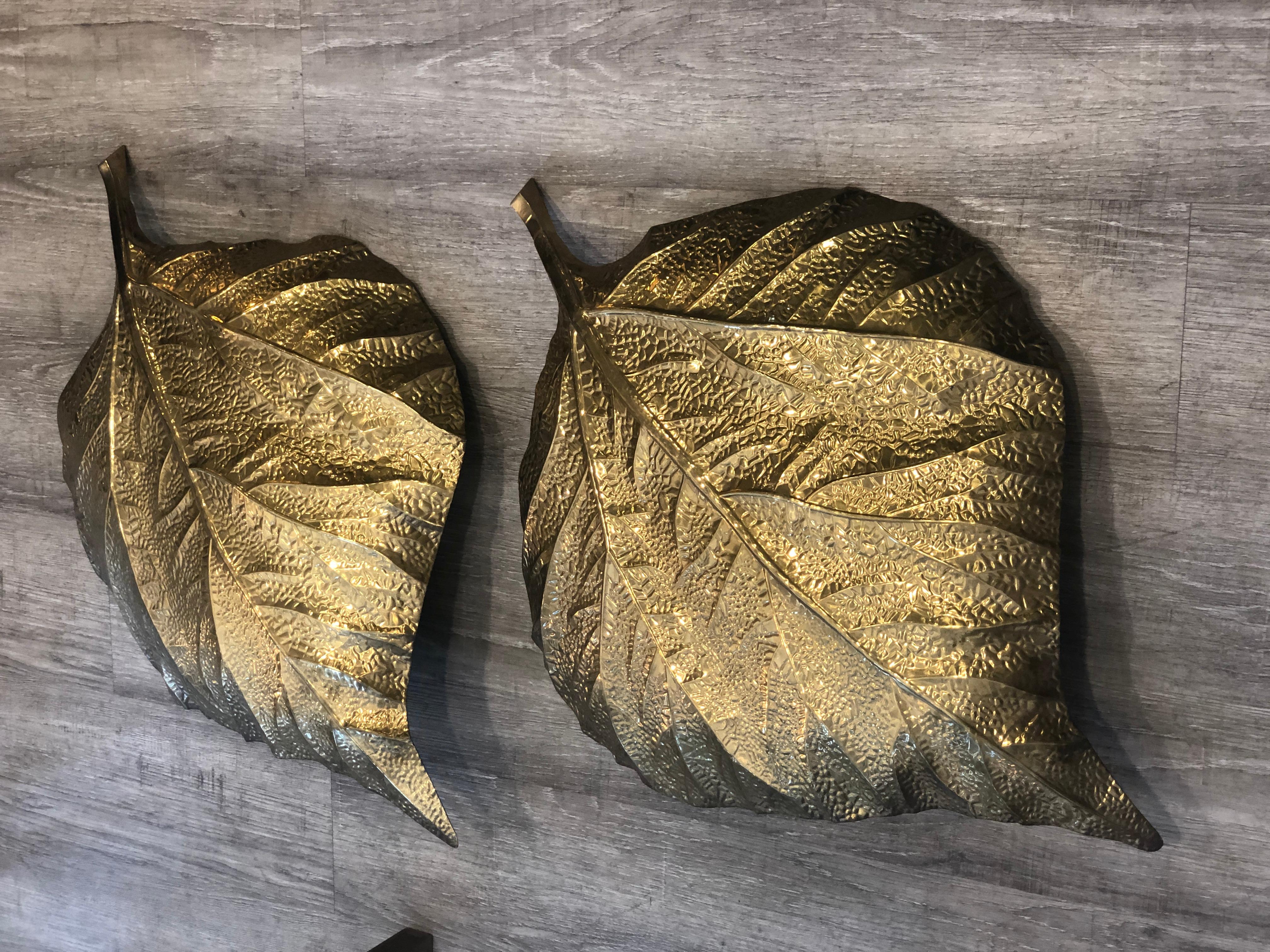 Attributed to the Italian designer Tommaso Barbi in 1960s, these lights representing rhubarb leaves are made in brass. They have been rewired, ready to be hanged. They have one light bulb each. Size: h 75 cm, w 54 cm. Overall condition are good,