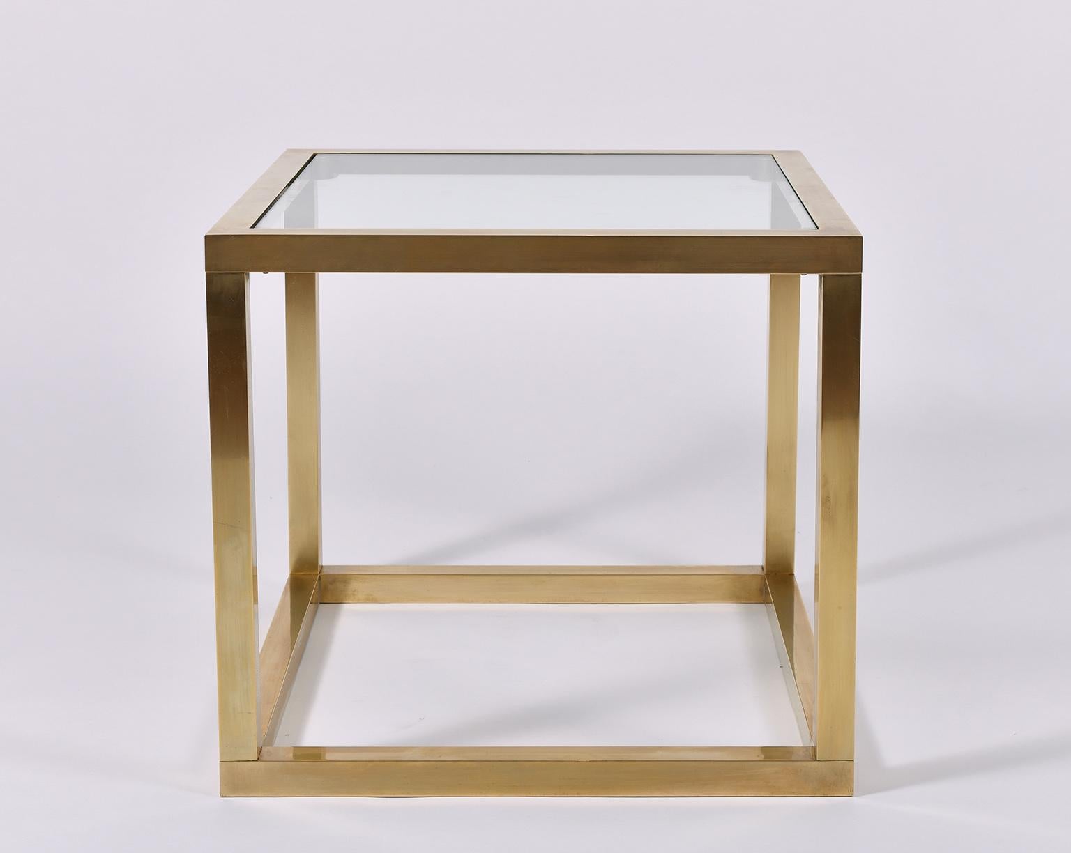 A brass square glass top side table.
France, circa 1970.