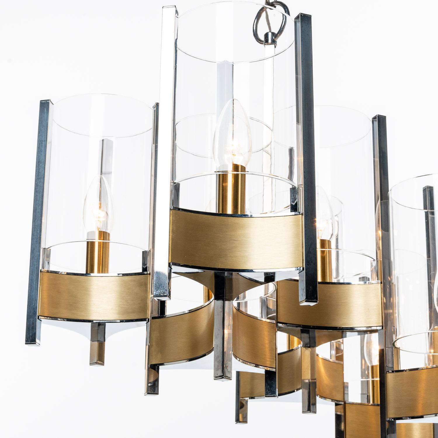 Classic rectangle shaped Gaetano Sciolari Hurricane style chandelier with characteristic use of chrome & brushed brass and with cylindrical glass shades. It holds twelve E14 lights. 

Please note, we have more chandeliers and scones in the same