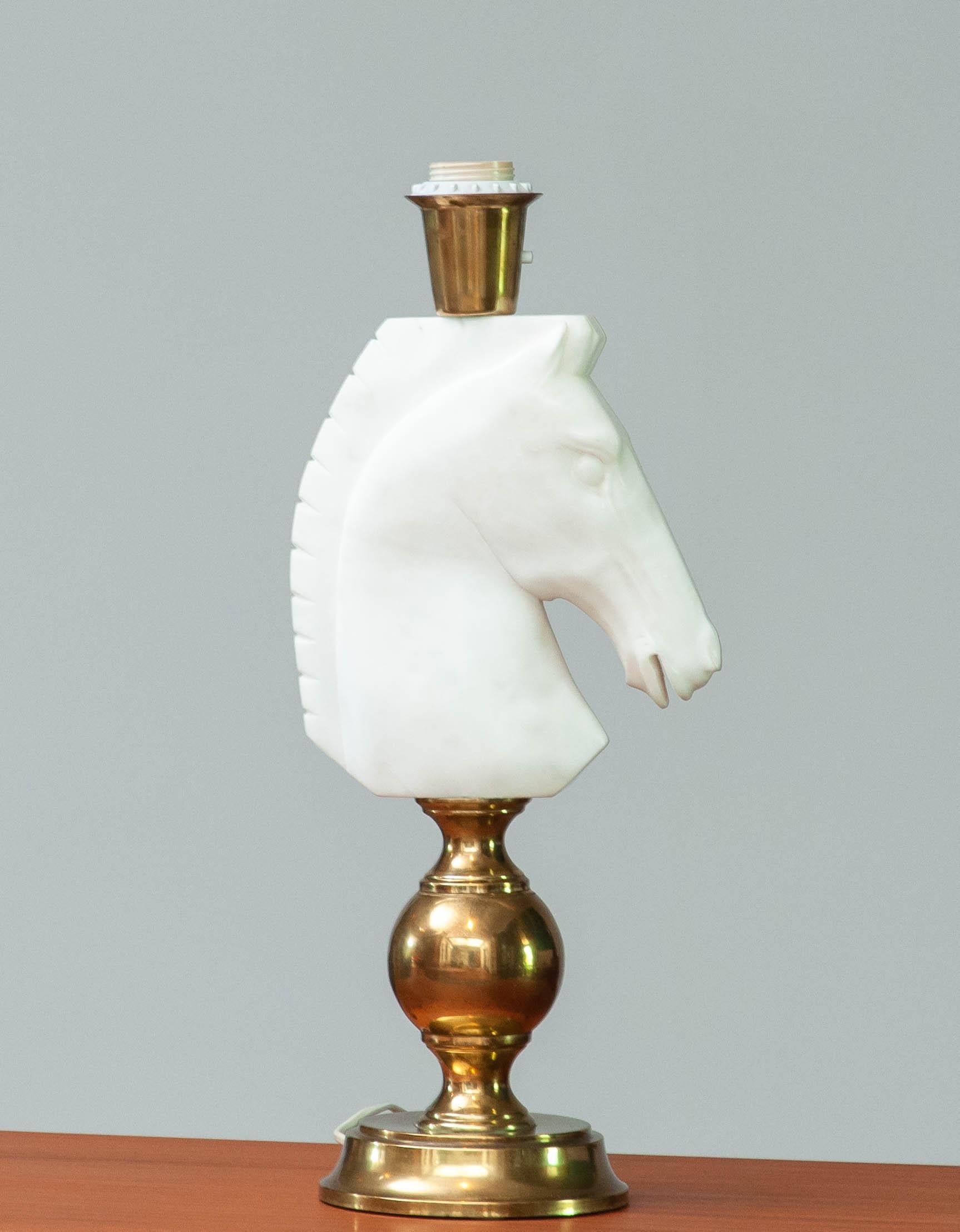 Beautiful and absolutely rare table lamp in brass and beautiful hand cut Italian alabaster horse head. This masterpieces combined with a great shade wil absolutely create a fabulous ambiance into your house.
Technically the lamp are in good