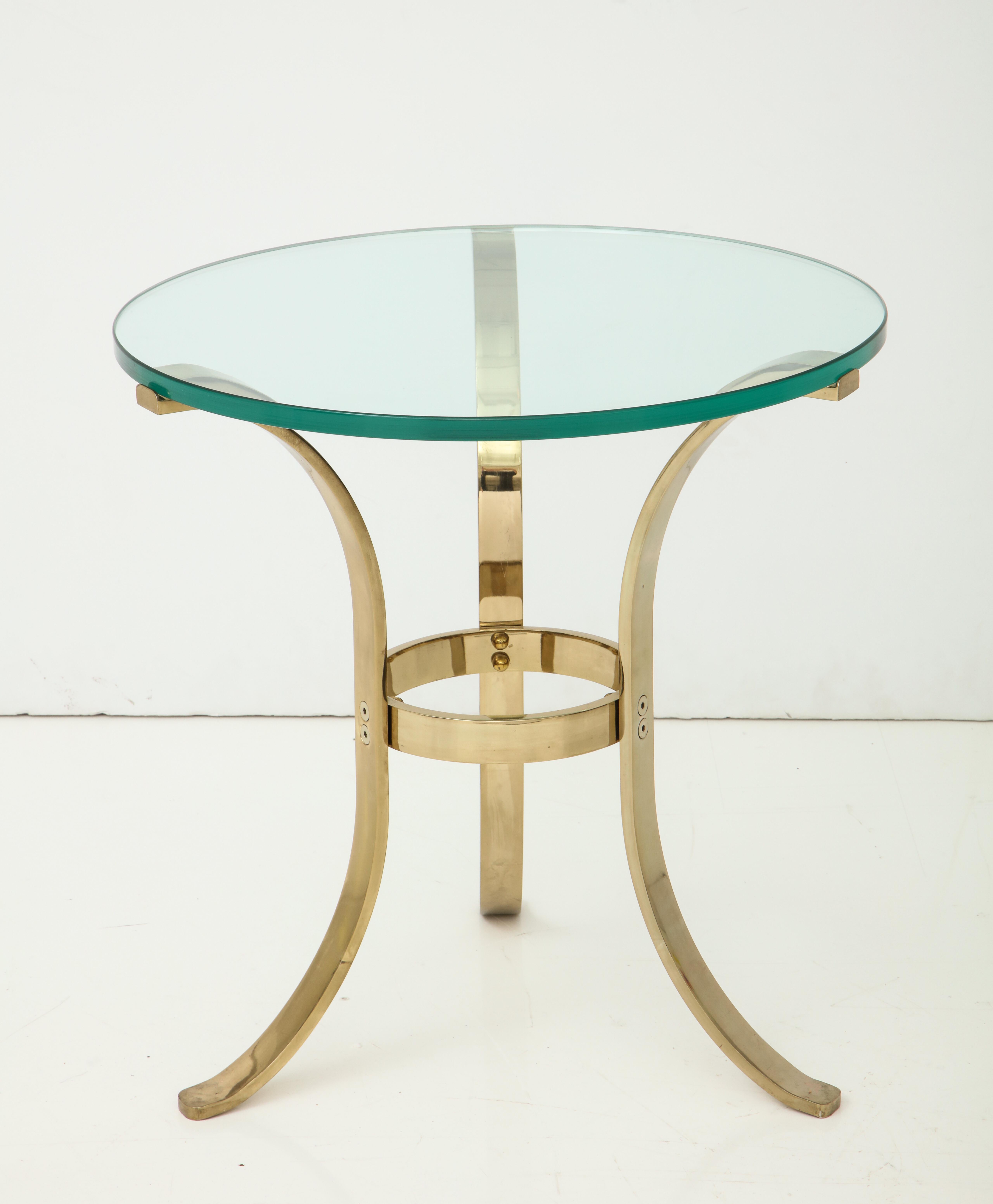 1970s polished brass tri-pod side table.
The heavy polished brass table base with minimal wear consistent with age supports a new 3/4