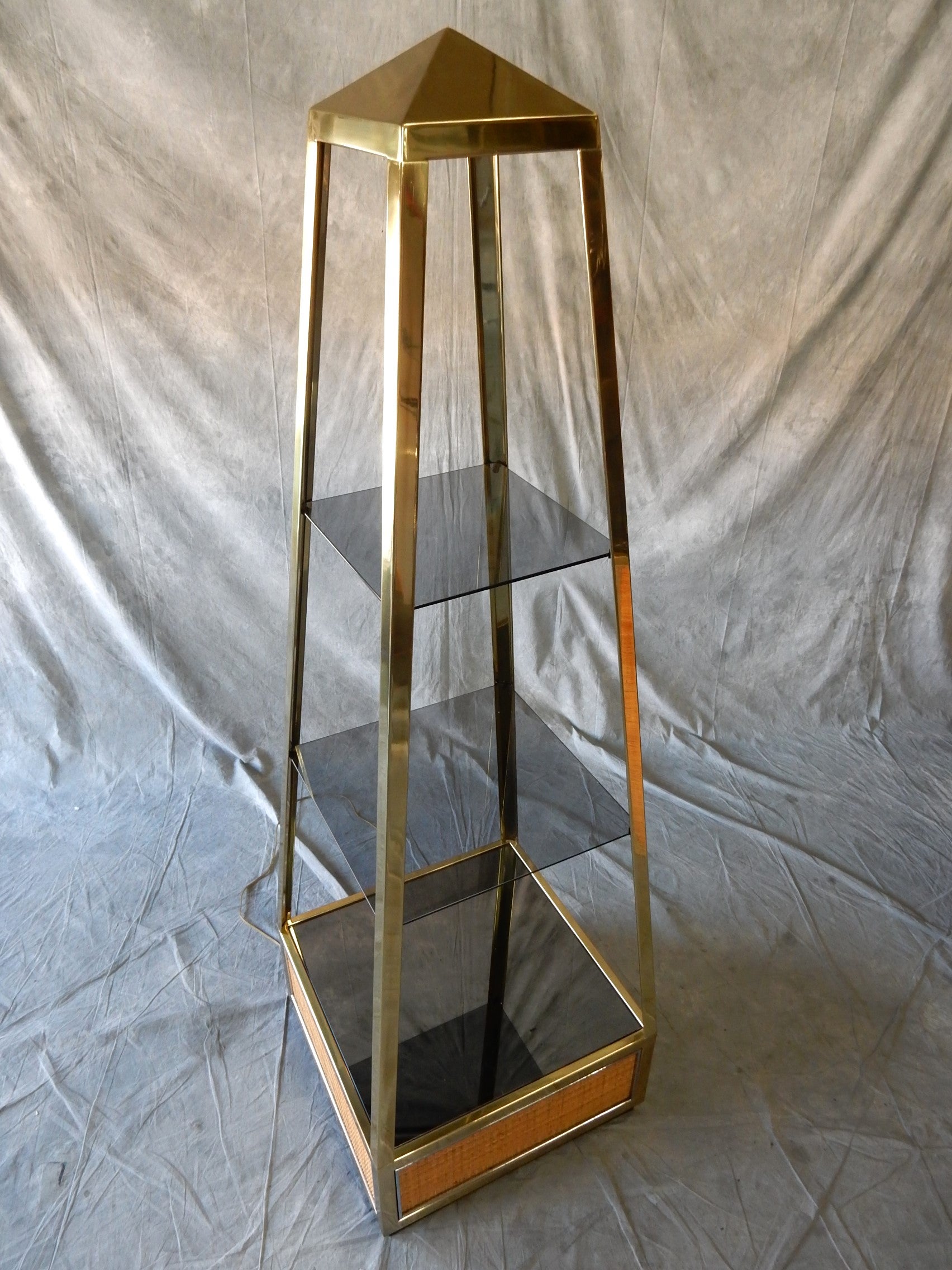 Exceptionally rare Romeo Rega design for Mario Sabot, Obelisk curio etagere'. Made in Italy, circa 1970's. 
Perfect for display of rare collectables, perfumes or even for use as a central dry bar.
3 levels with a single low drawer. Dome light at the