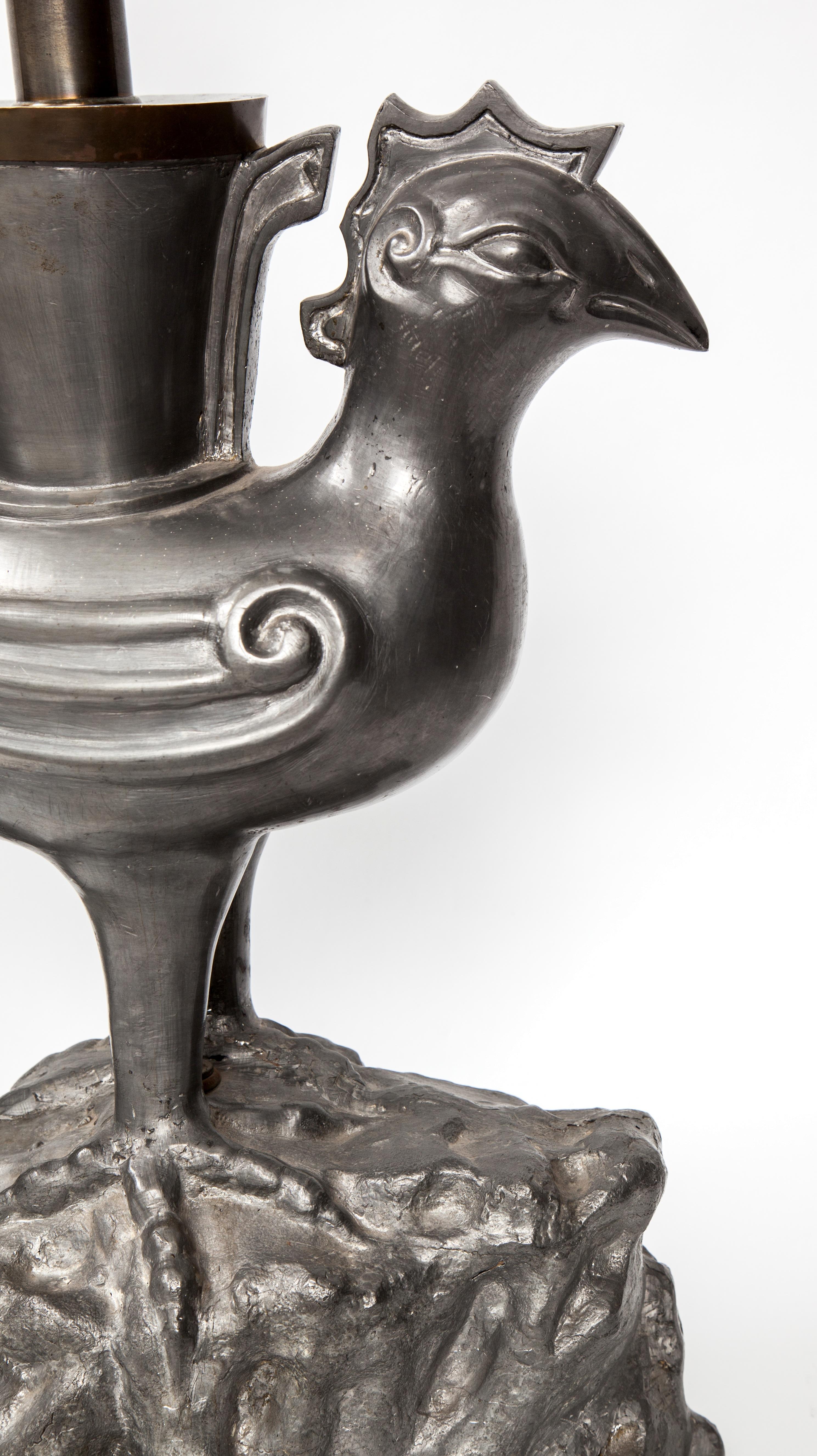 Superb and Dramatic 1970s On the Rocks, bird lamp in pewter and brass. This piece is so unique from it's size and scale to it's over the top sculptural design and subtle use of mixed metals. Unsigned.

Measures: The height to the top of the bird is