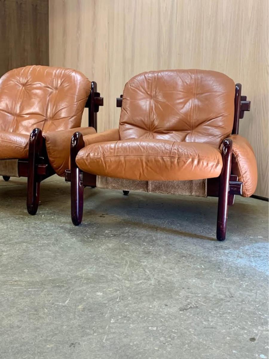One of the most exciting finds we’ve had in some time, this exceptional pair of easy chairs by Jean Gillon, designed in the 1970s, is a true statement piece. With robust hardwood frames showcasing remarkable through-tenon and tusk-wedge joinery,