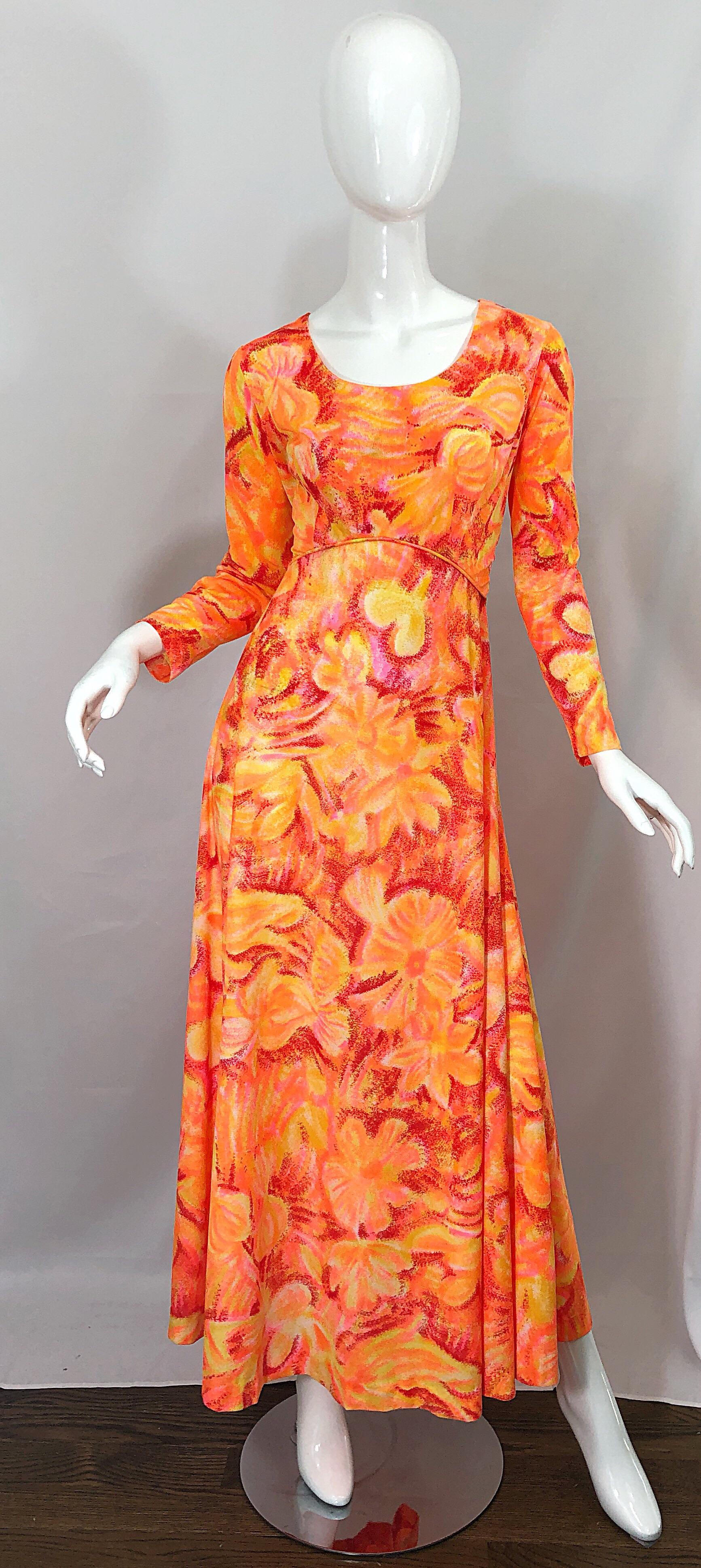 Amazing 1970s bright neon orange and hot pink abstract flower print long sleeve jersey maxi dress! Features a flattering empire waist style fit, with a fitted bodice and a free flowing full skirt. Soft nylon blend jersey fabric stretches to fit.