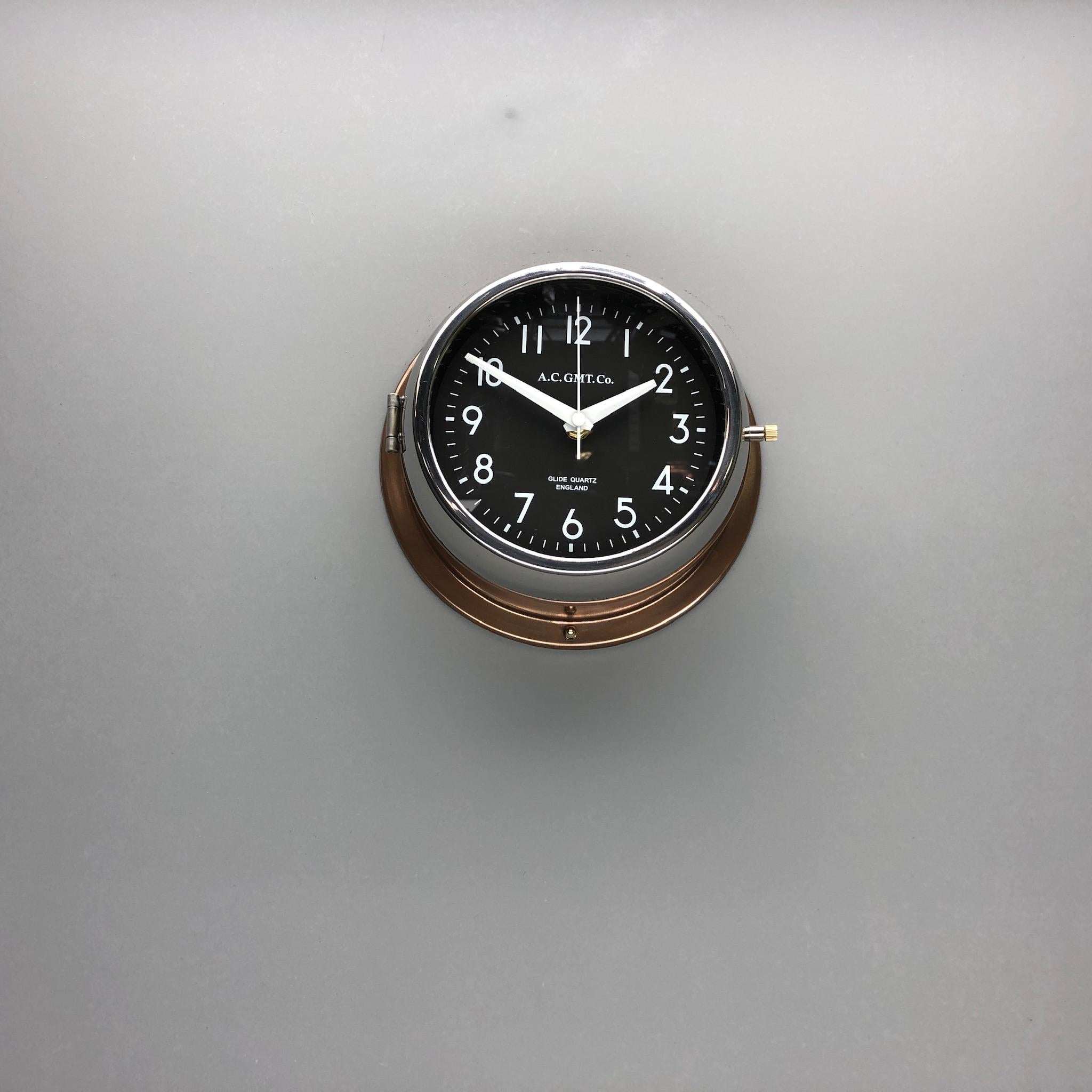 Late 20th Century 1970s British Bronze AC.GMT.Co. Industrial Wall Clock Chrome Bezel Black Dial