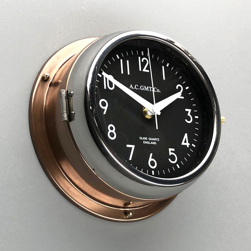 English 1970s British Bronze AC.GMT.Co. Industrial Wall Clock Chrome Bezel Black Dial For Sale
