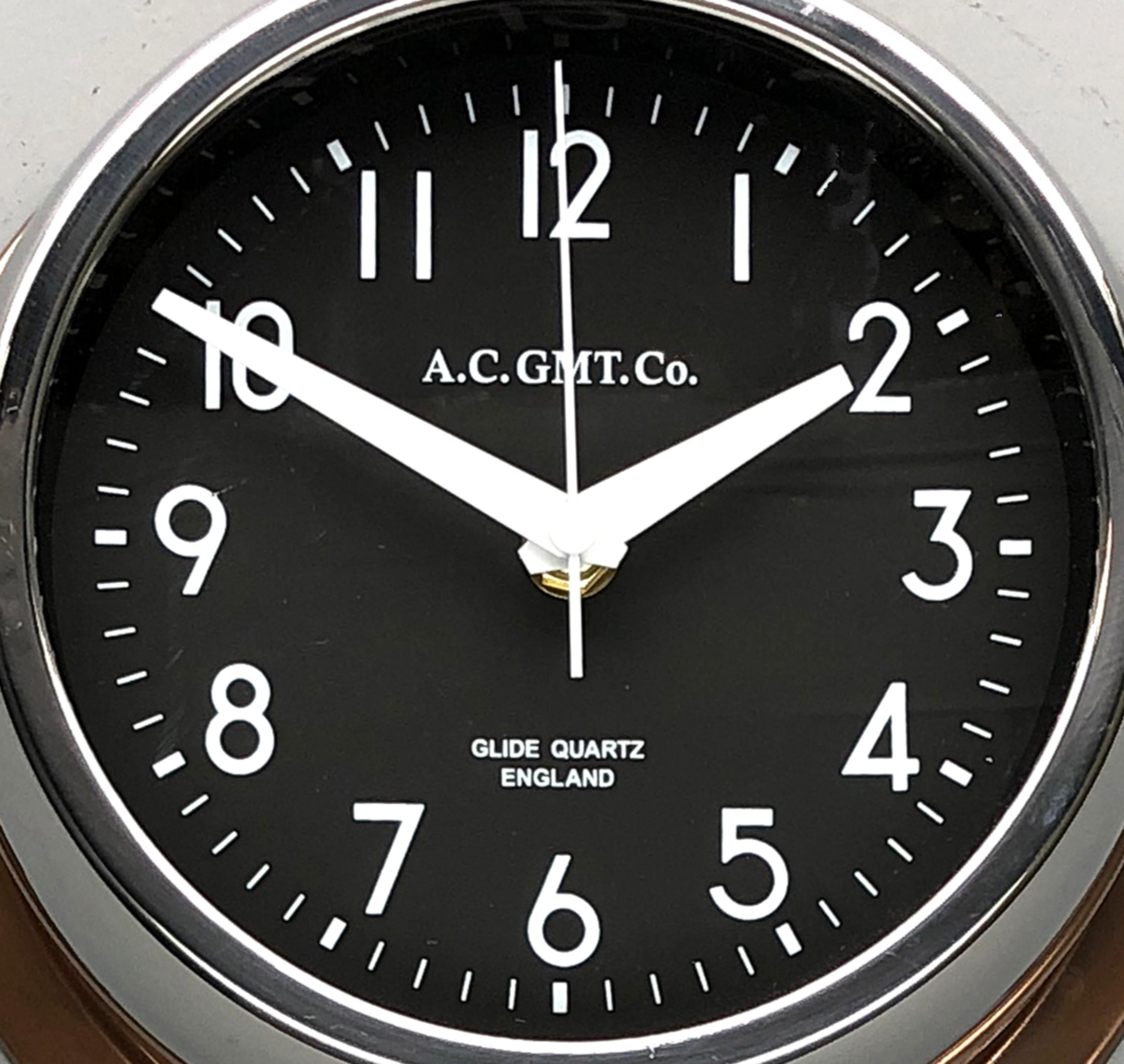 English 1970s British Bronze AC.GMT.Co. Industrial Wall Clock Chrome Bezel Black Dial