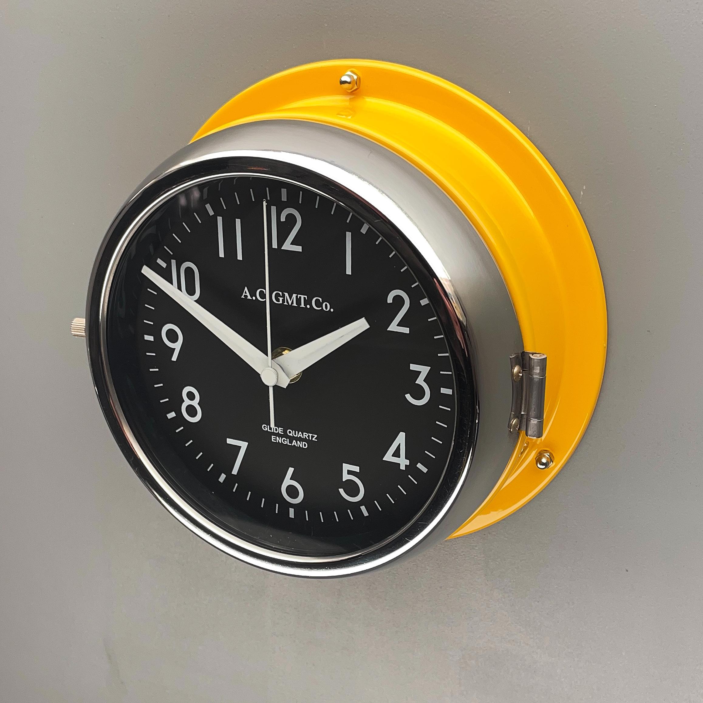 1970s British Yellow Illumination AC GMT Co. Classic Quartz Wall Clock For Sale 1