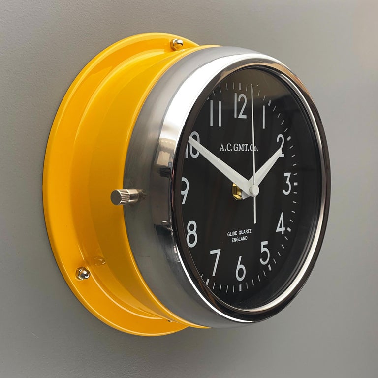 English 1970s British Yellow Illumination AC GMT Co. Classic Quartz Wall Clock For Sale
