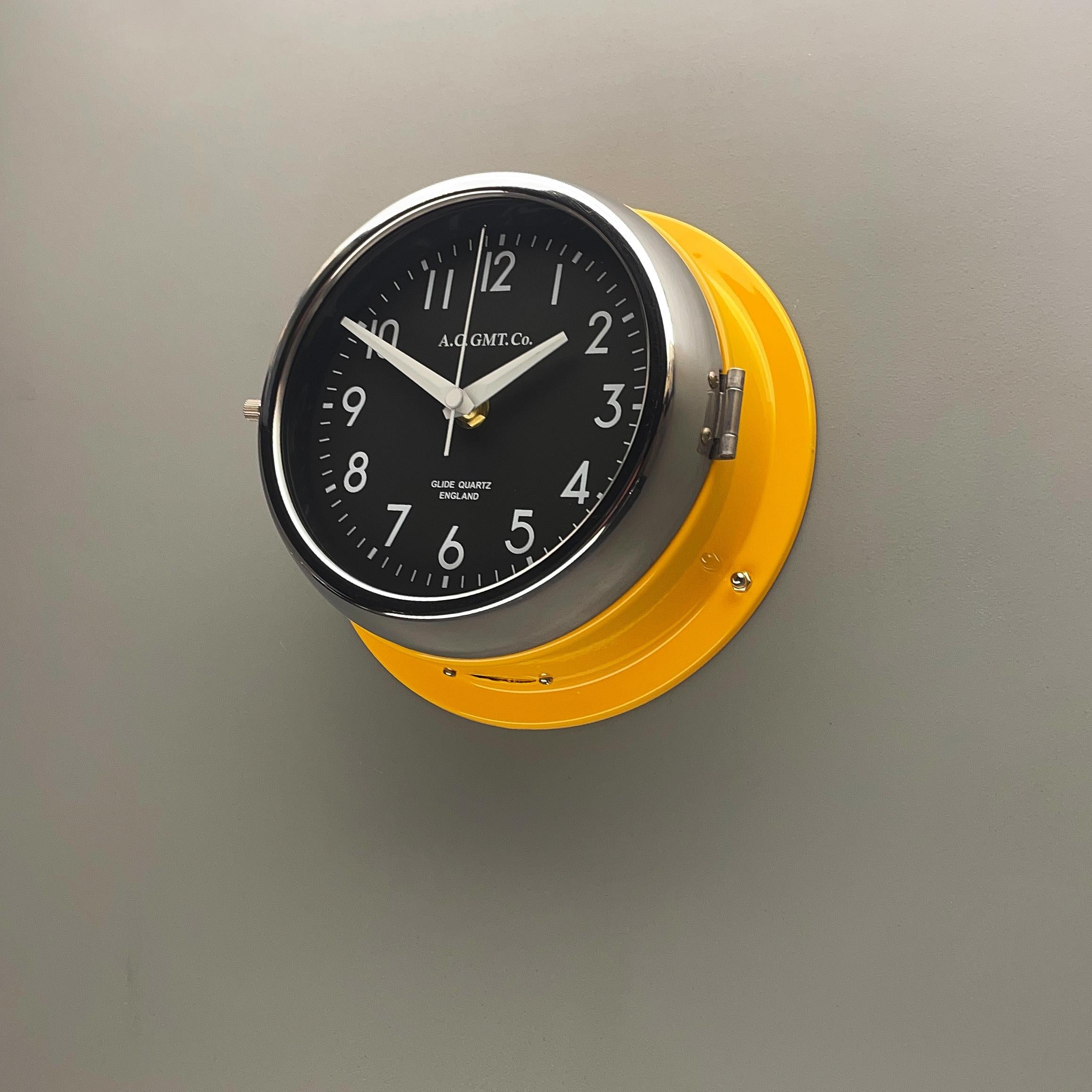 English 1970s British Yellow Illumination AC GMT Co. Classic Quartz Wall Clock For Sale