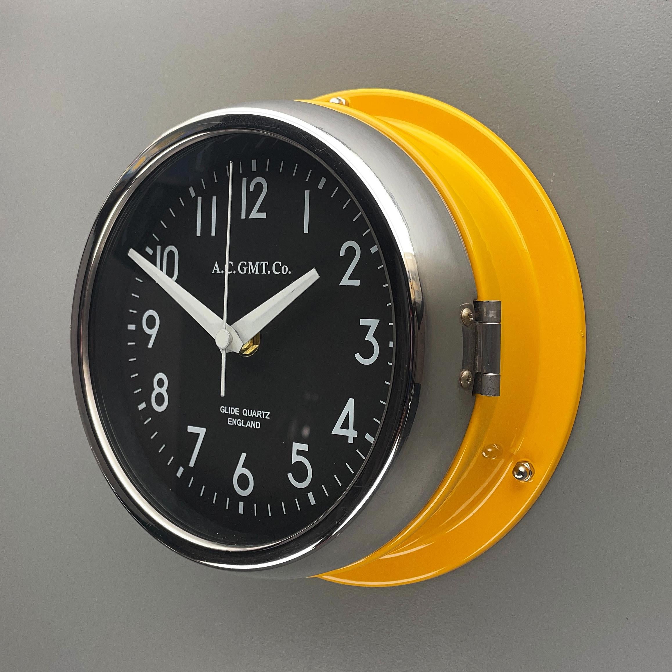 Glazed 1970s British Yellow Illumination AC GMT Co. Classic Quartz Wall Clock For Sale