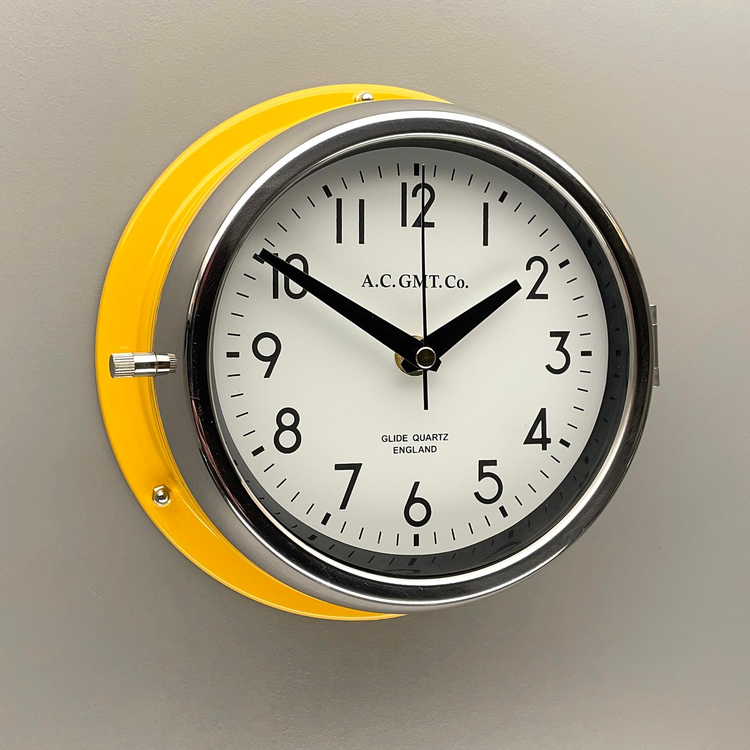 1970's British Yellow Illumination & White AC GMT Co. Classic Quartz Wall Clock In Excellent Condition In Leicester, Leicestershire