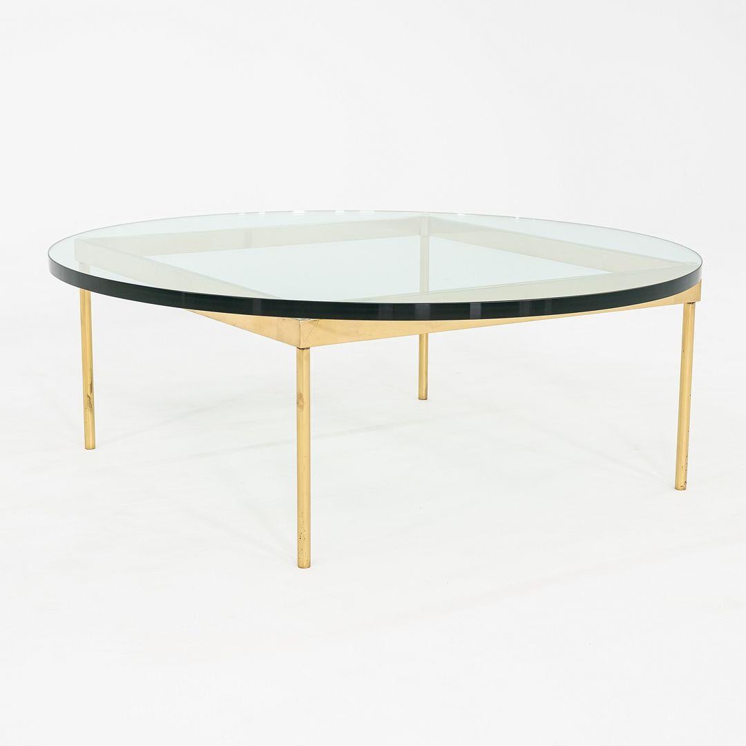 This is a Large 1970s Coffee Table in Bronze and Glass, attributed to designer Ward Bennett for Brickel Associates. In this design, it pairs a square-edged base with a round top, allowing the simple shapes to work together, despite the obvious