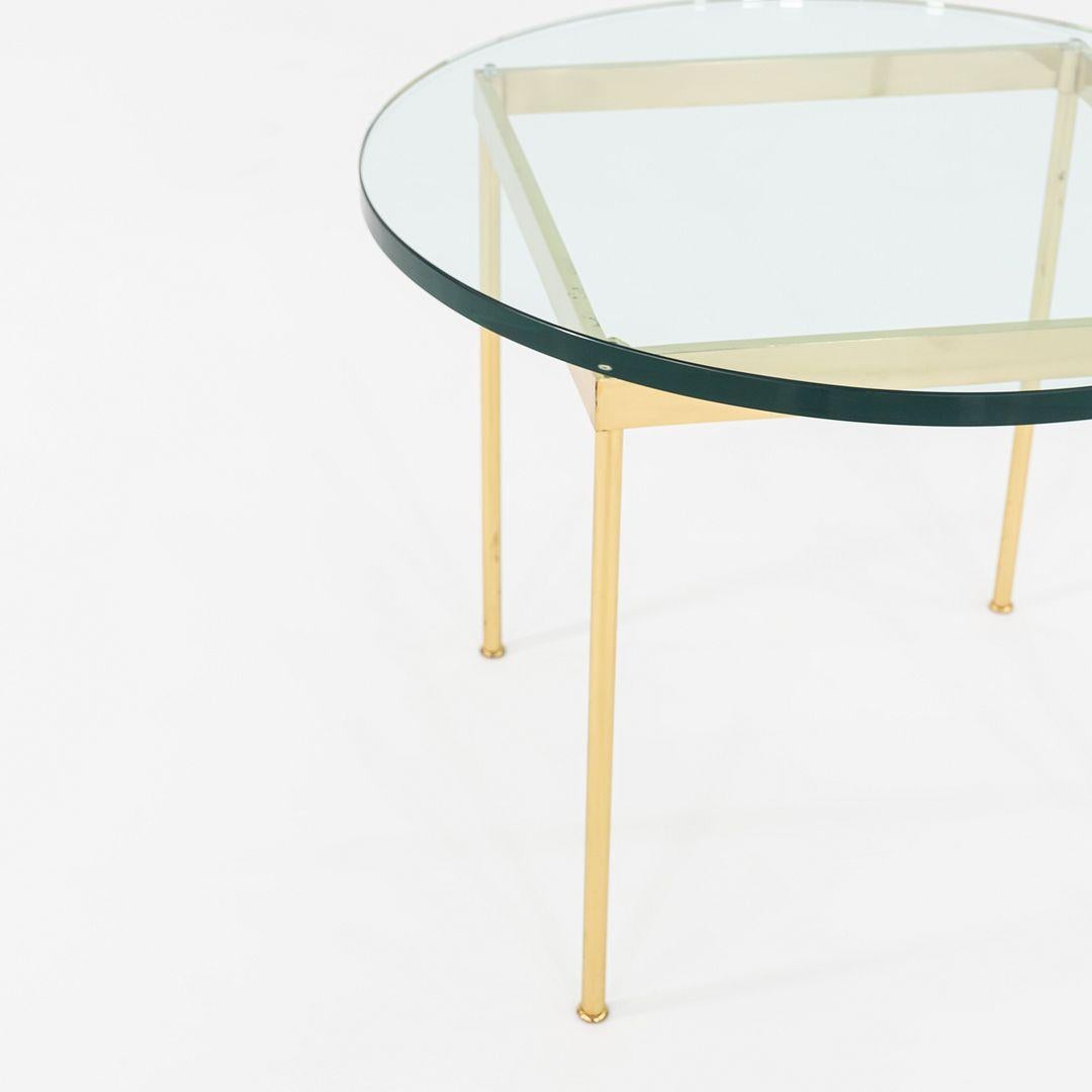 This is a bronze and glass side table, attributed to Ward Bennett. This particular example was produced in the 1970s. The exact designer and manufacturer are unknown.
 
 The table measures 30 inches in diameter and 23 inches high. This piece does