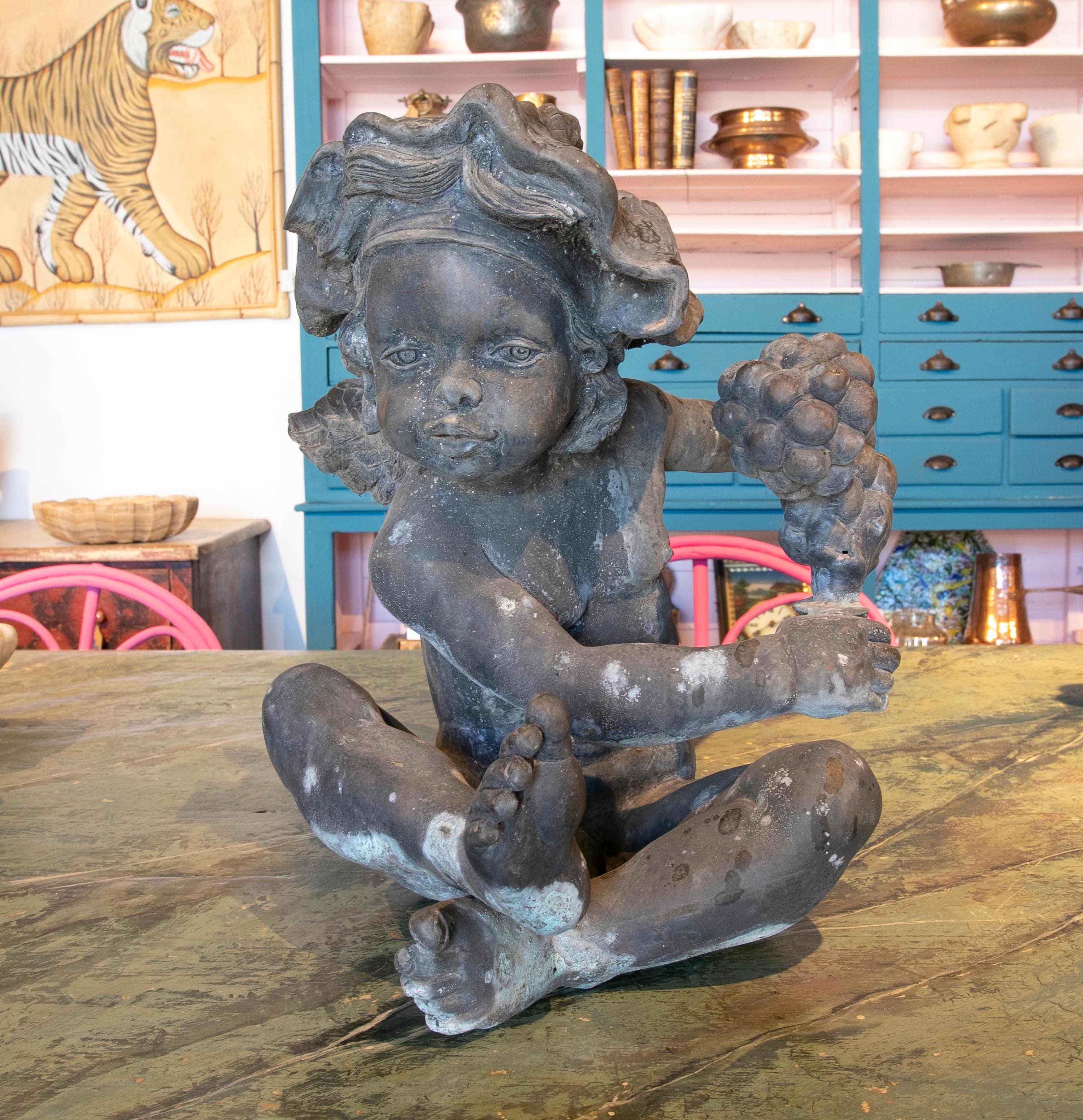 1970s Bronze French Bacchus Boy Sculpture with Wings and Grapes.