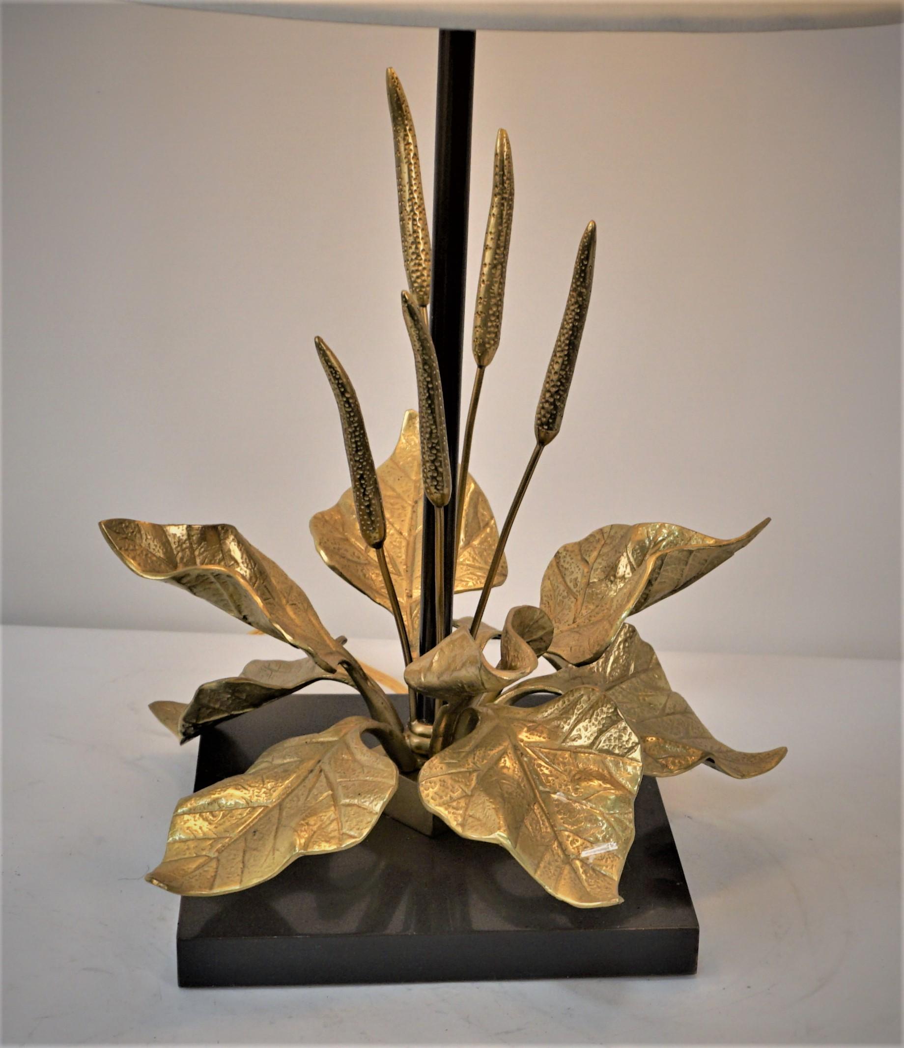 Bronze table lamp, in the style of Maison Charles, is made of bronze wheat and leaves on a black base. 
Professionally rewired with two pull chain sockets and fitted with silk hardback lampshade. 
Measurment includes the lampshade.