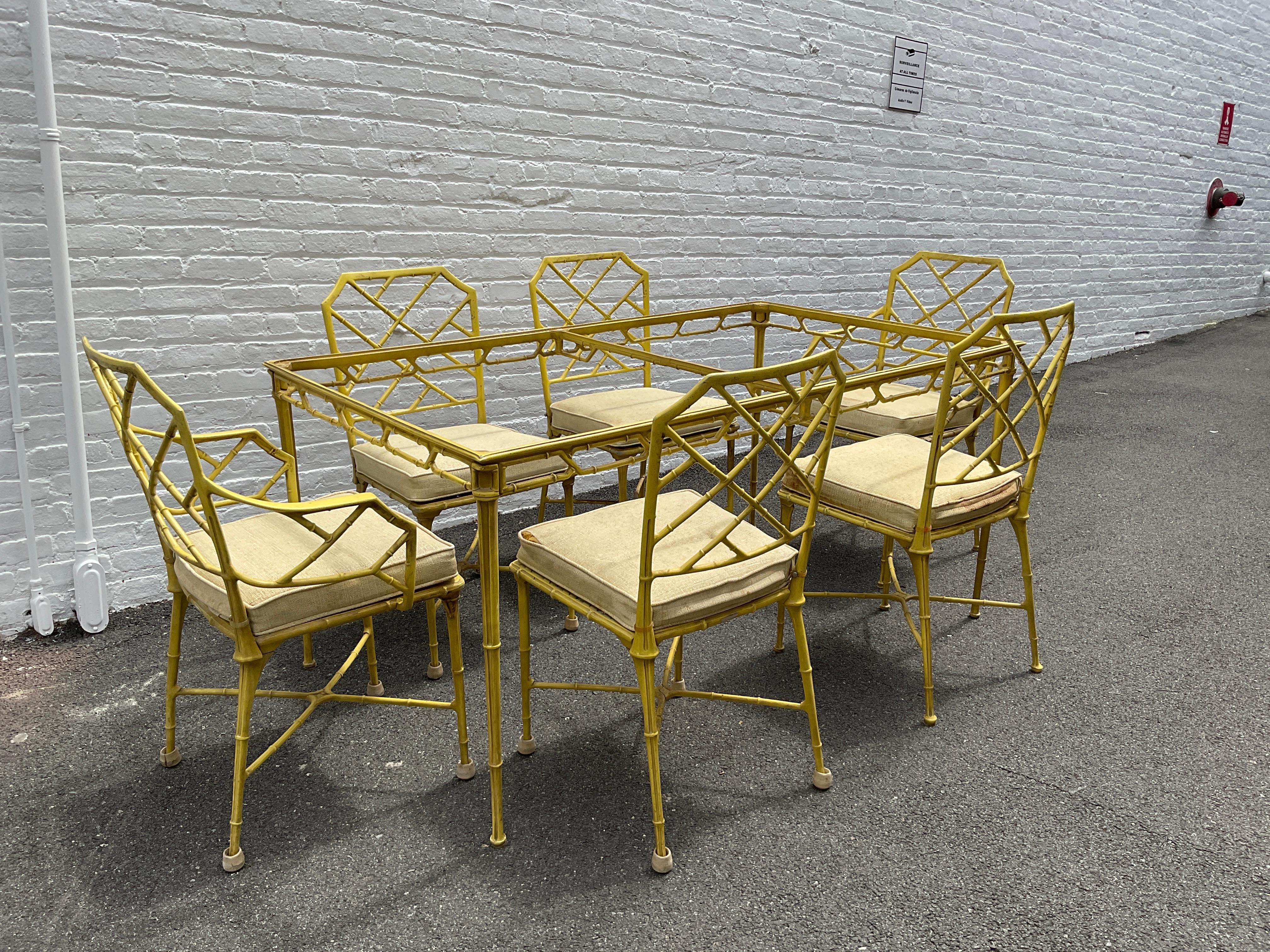 1970s Brown Jordan Calcutta faux bamboo dining set designed by Hall Bradley. Chinese Chippendale design. 6 chairs one dining table. There are 2 arm chairs and 4 side chairs . There is NO glass for this set. Set needs painting. Cushions need to be