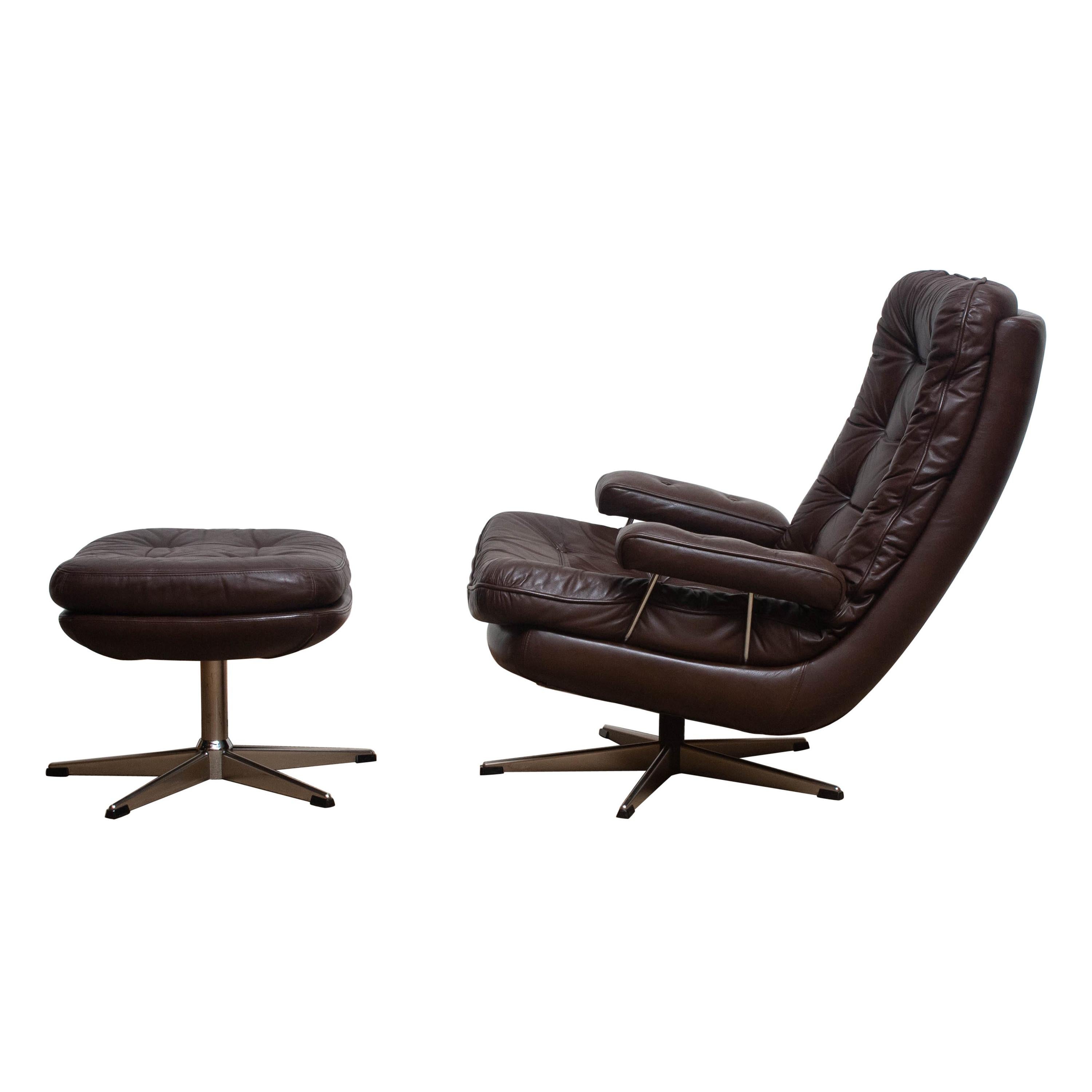 Beautiful swivel lounge chair and ottoman, Sweden.
The chair and ottoman have a dark brown leather seating on a chromed swivel frame.
It is in a mint condition,
circa 1970s.
Dimensions: H 90 cm x W 78 cm x D 93 cm x SH 40 cm.