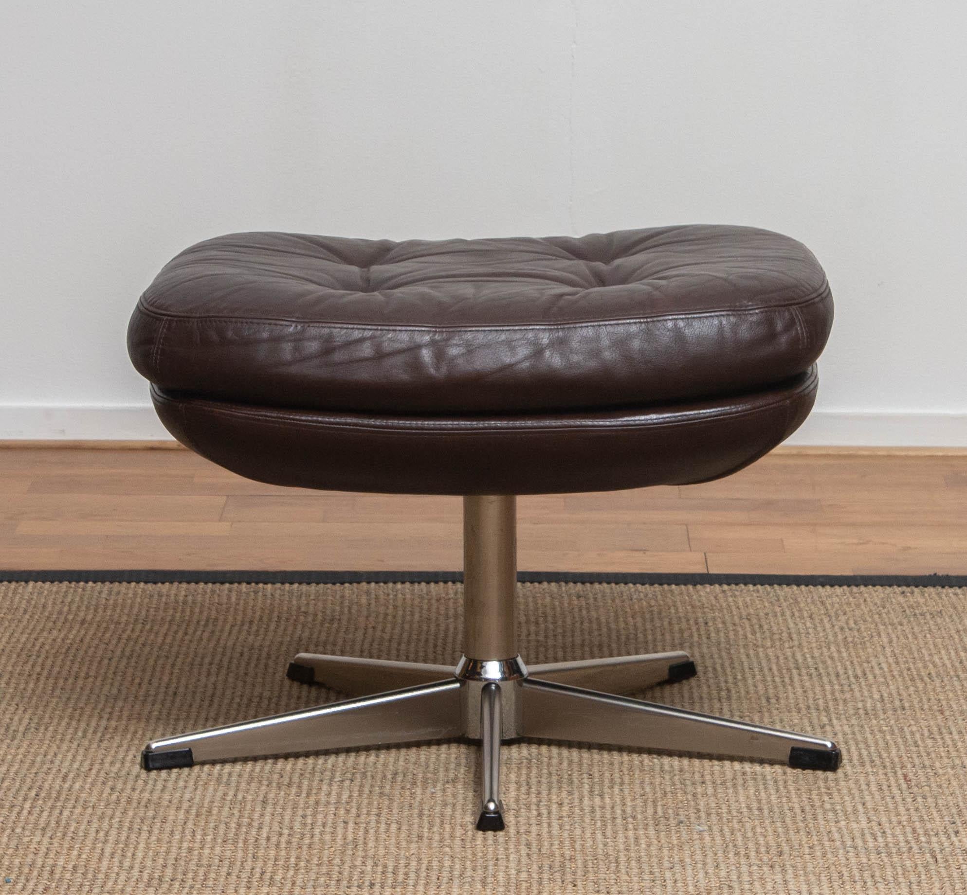 Swedish 1970s, Brown Leather and Chrome Swivel Lounge Chair and Ottoman, Sweden