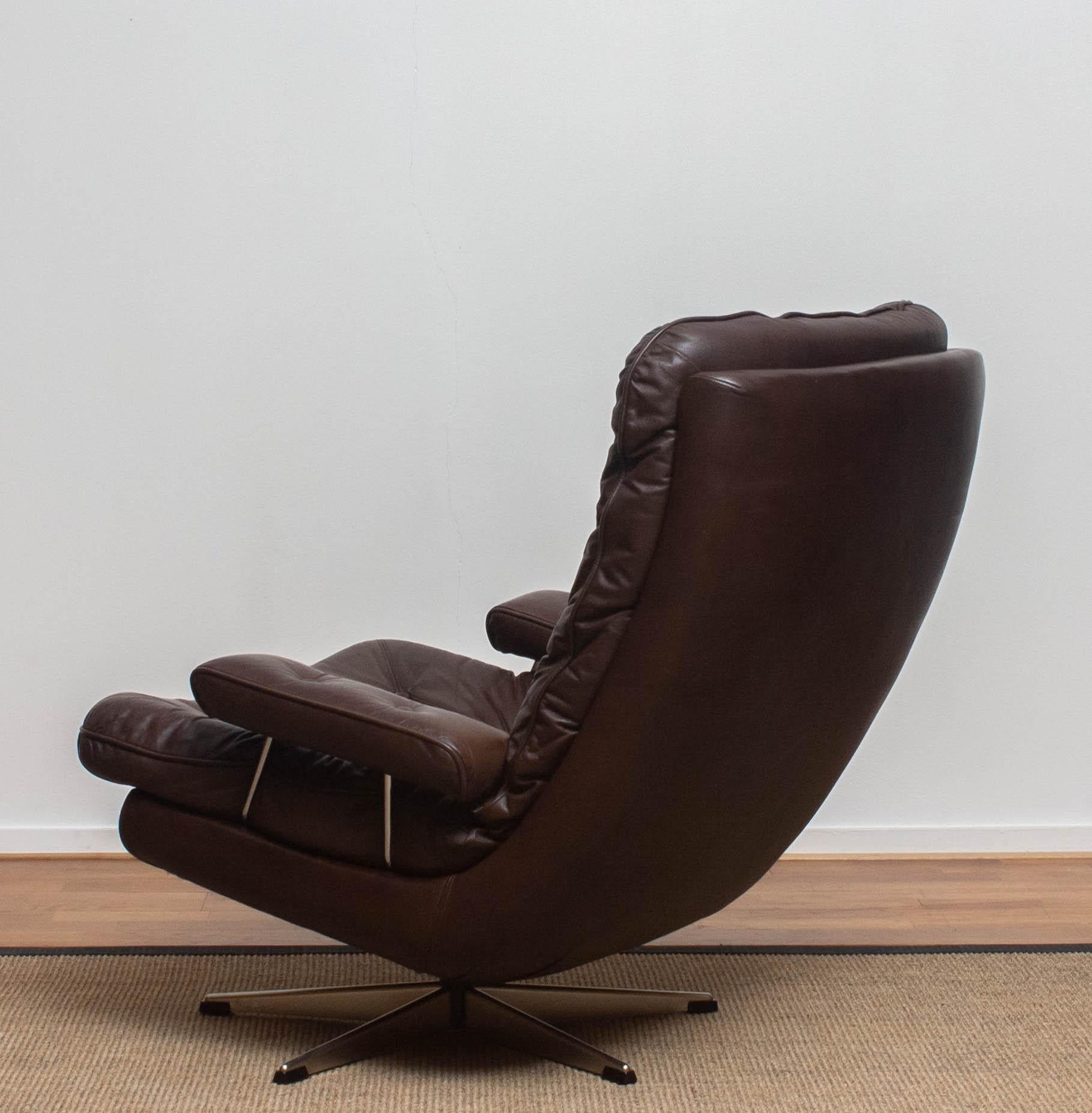 Swedish 1970s, Brown Leather and Chrome Swivel Lounge Chair and Ottoman, Sweden