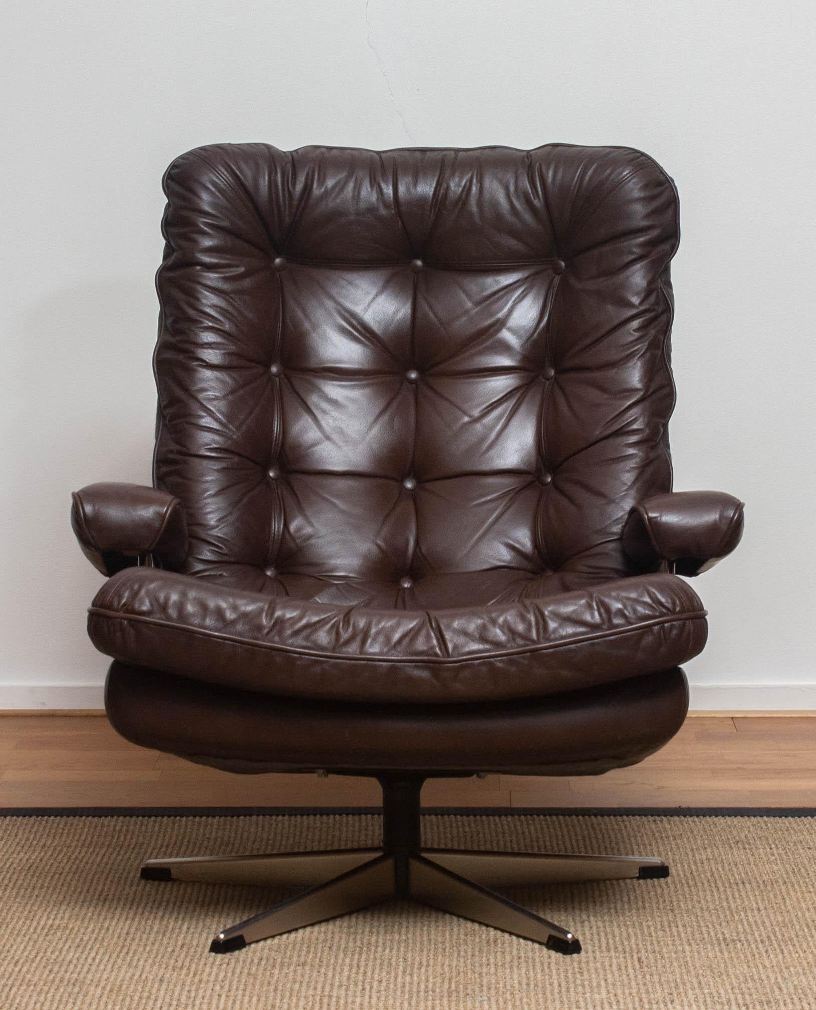 Steel 1970s, Brown Leather and Chrome Swivel Lounge Chair and Ottoman, Sweden
