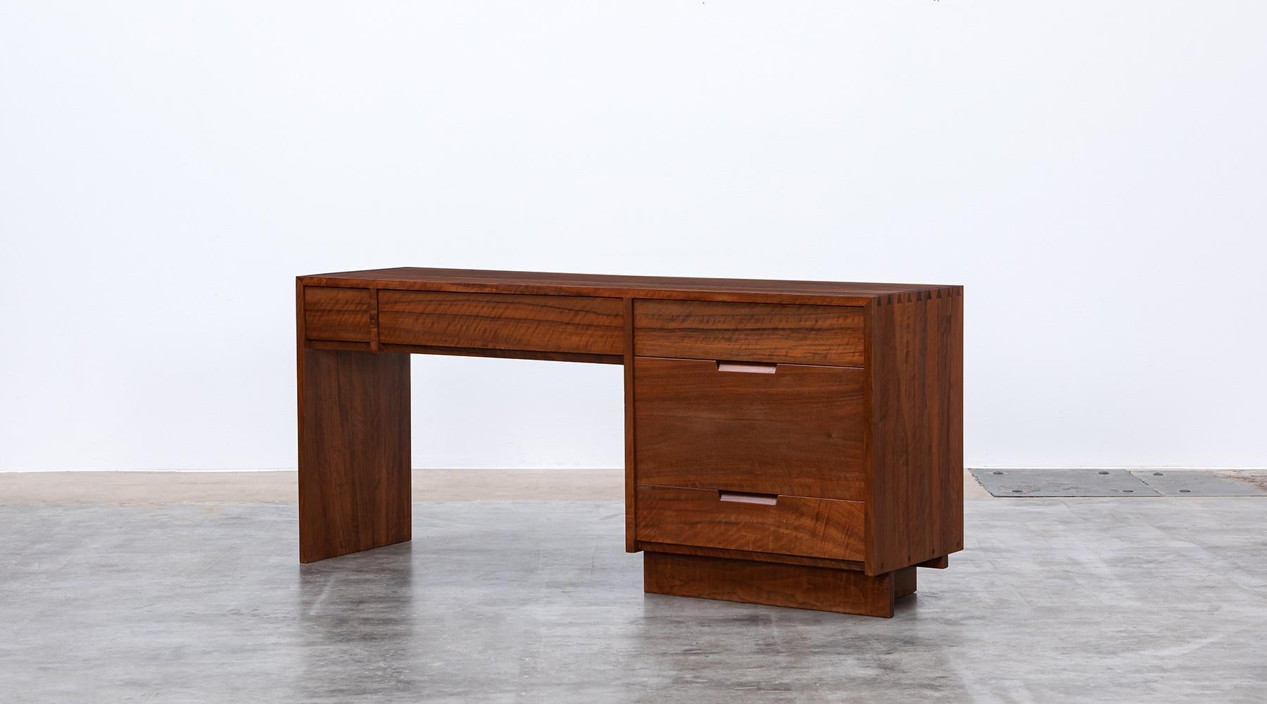 Desk by George Nakashima, American walnut, USA, 1970s.

Handcrafted, stunning, marvelous desk. This example is constructed with American walnut with handwork by George Nakashima himself. This handcrafted desk has a beautifully shape, very pure