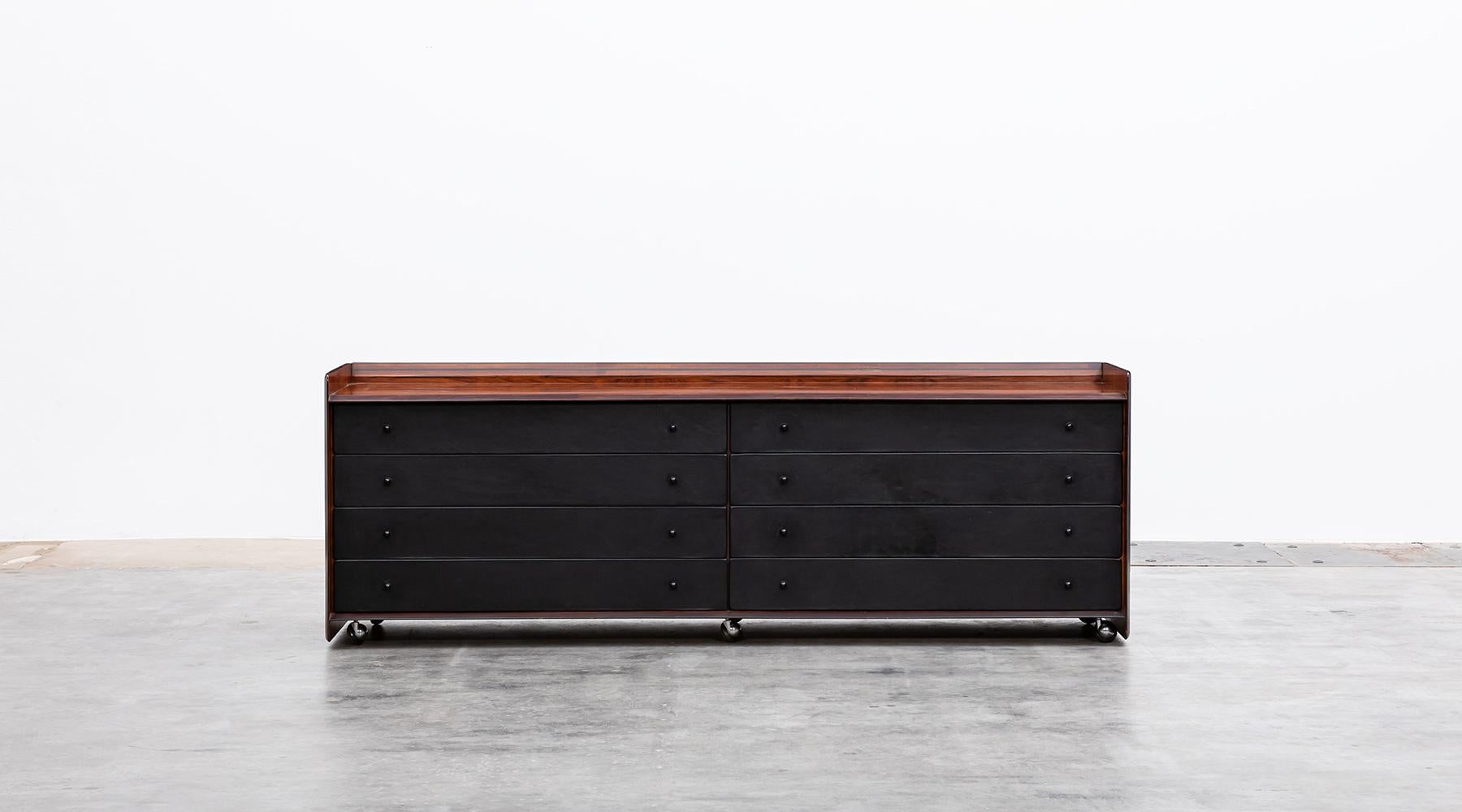 Sideboard, Afra and Tobia Scarpa, walnut and leather, Italy, circa 1975.

Handsome Cabinet in walnut with eight leather drawers decorated with small round wooden handles. Comes in good original condition. Manufactured by Maxalto. Afra and Tobia