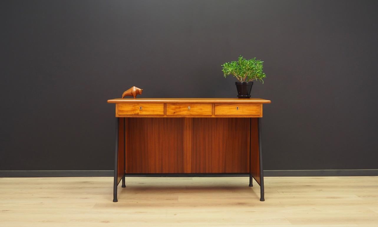 Beautiful desk from the 1960s-1970s, Danish design, Minimalist form, finished with mahogany veneer. Front with three practical drawers. The key in the set. Preserved in good condition (small bruises and scratches), directly for use.

Dimensions: