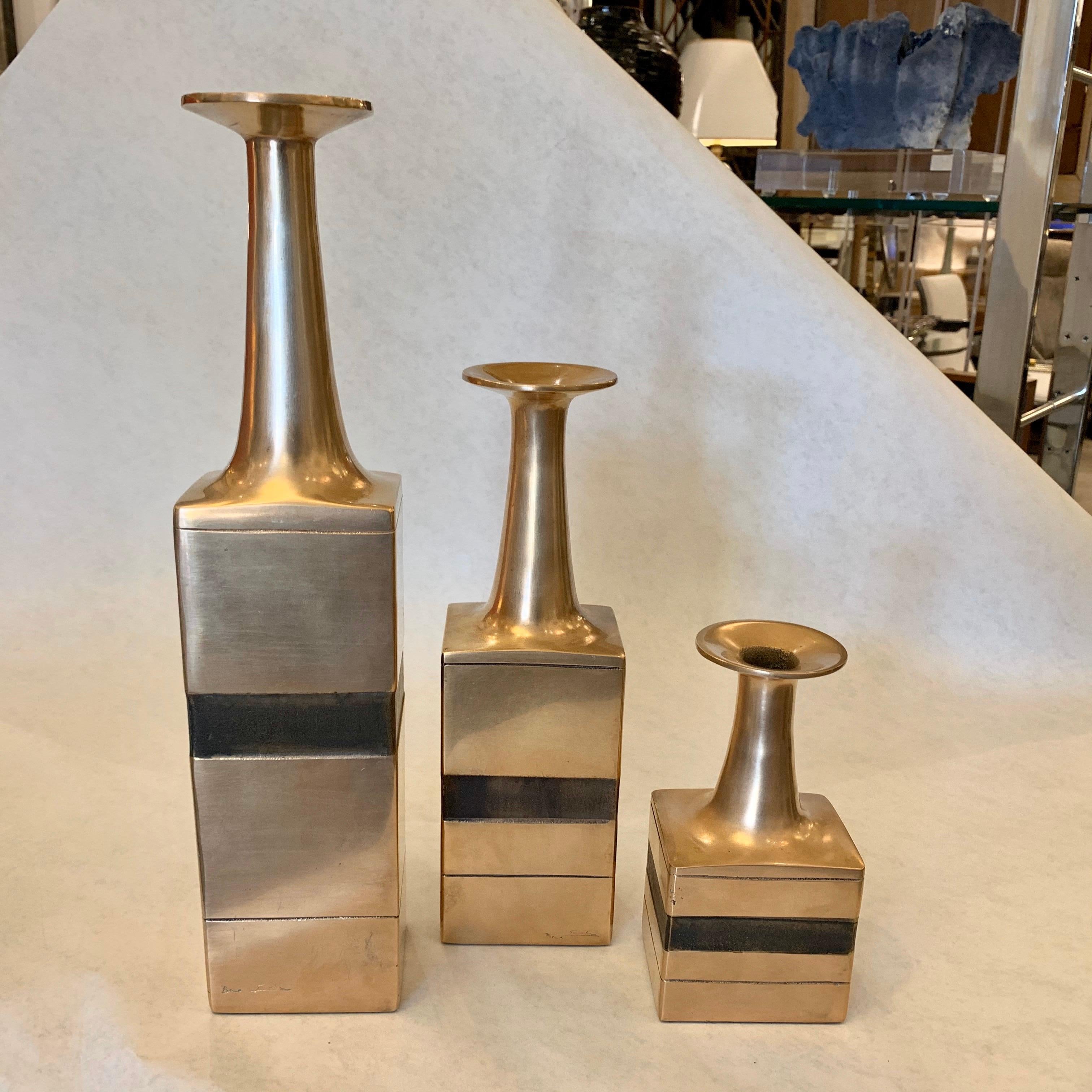 Extremely rare in set of three Gambone bronze vases; a flared opening with an elegant tapered neck ending in a solid geometrical base. Label to bottom ESART, Italy, circa 1970. These are cast and enameled bronze in descending