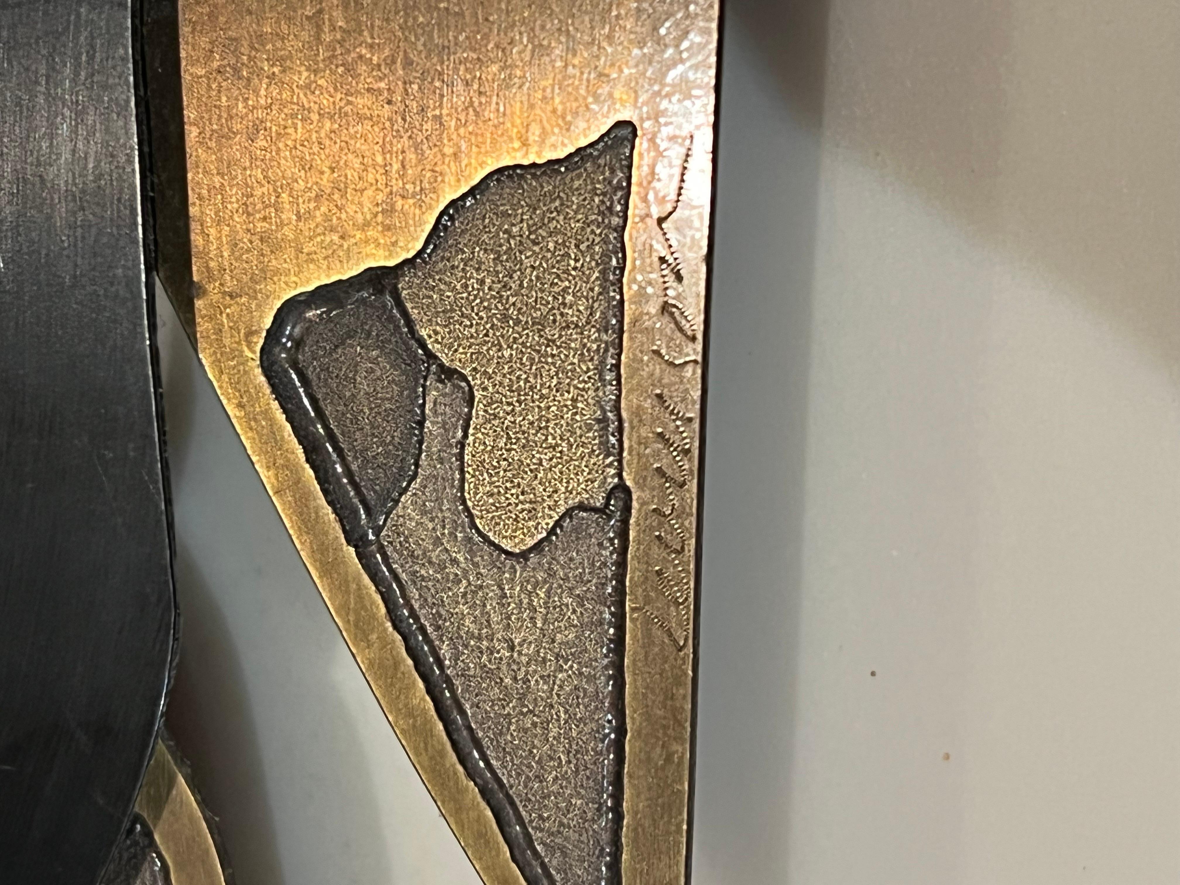 Rare Bronze abstract wall relief mixed metals sitting on plastic resin with brass aluminum frame circa 1970's, signed by New York artist Michael Levinson.