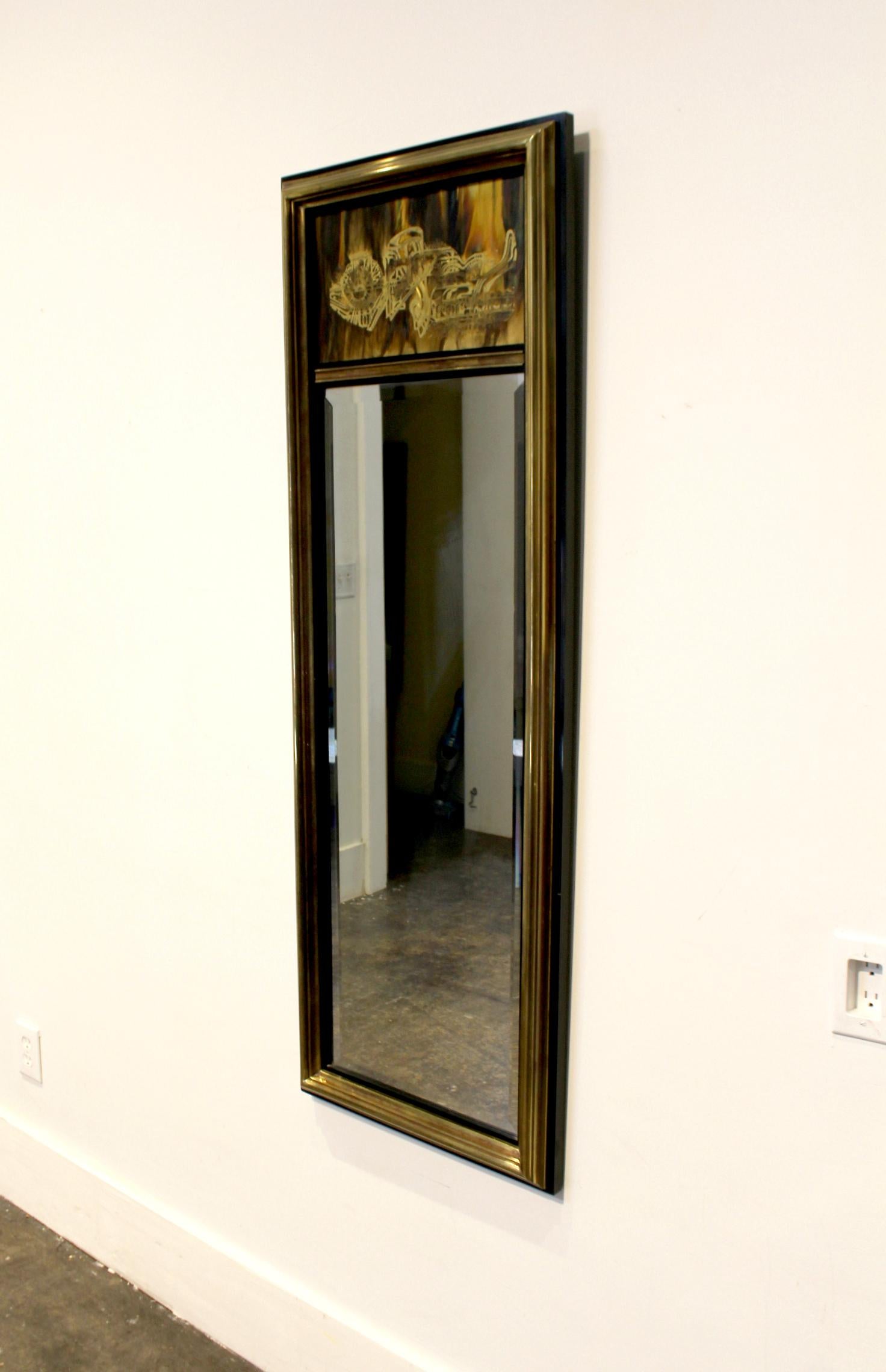 Acid etched brass plate with brass and lacquered wood frame. Mirror with frame is 57