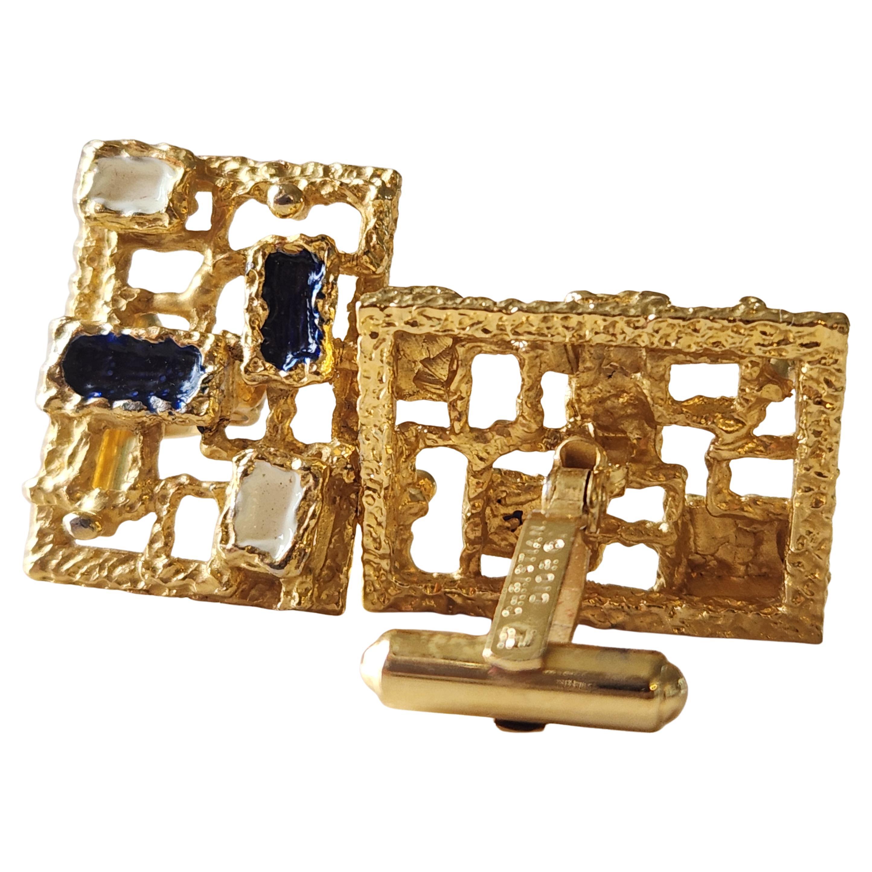 AMBIANIC presents
1970s Brutalist Christian Dior Gold Tone Enamel Stone Cufflinks
stamped by maker
approximately 1 x .75 x 1
Preowned original unrestored vintage
One cufflink back stem has flexibility, appears loose- untested.
Refer to images.