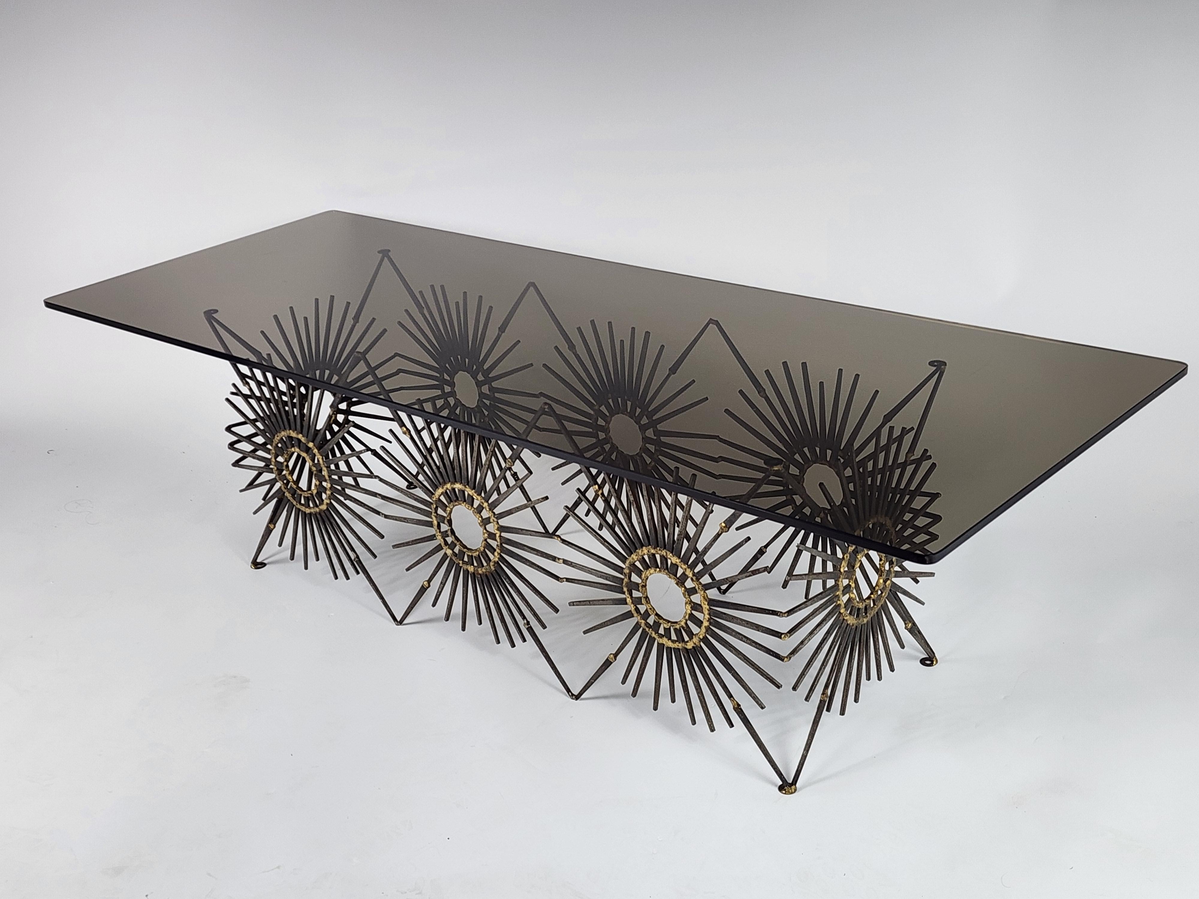 Brutalist coffee table. 

Made with cut nails and brass welding. 

Solid well made with quality Material.

Smoked glass top is in very good conditition with no scratches or flea bites.

It Measure 3/8 in. thick. by 54in. long by 20 in, wide.