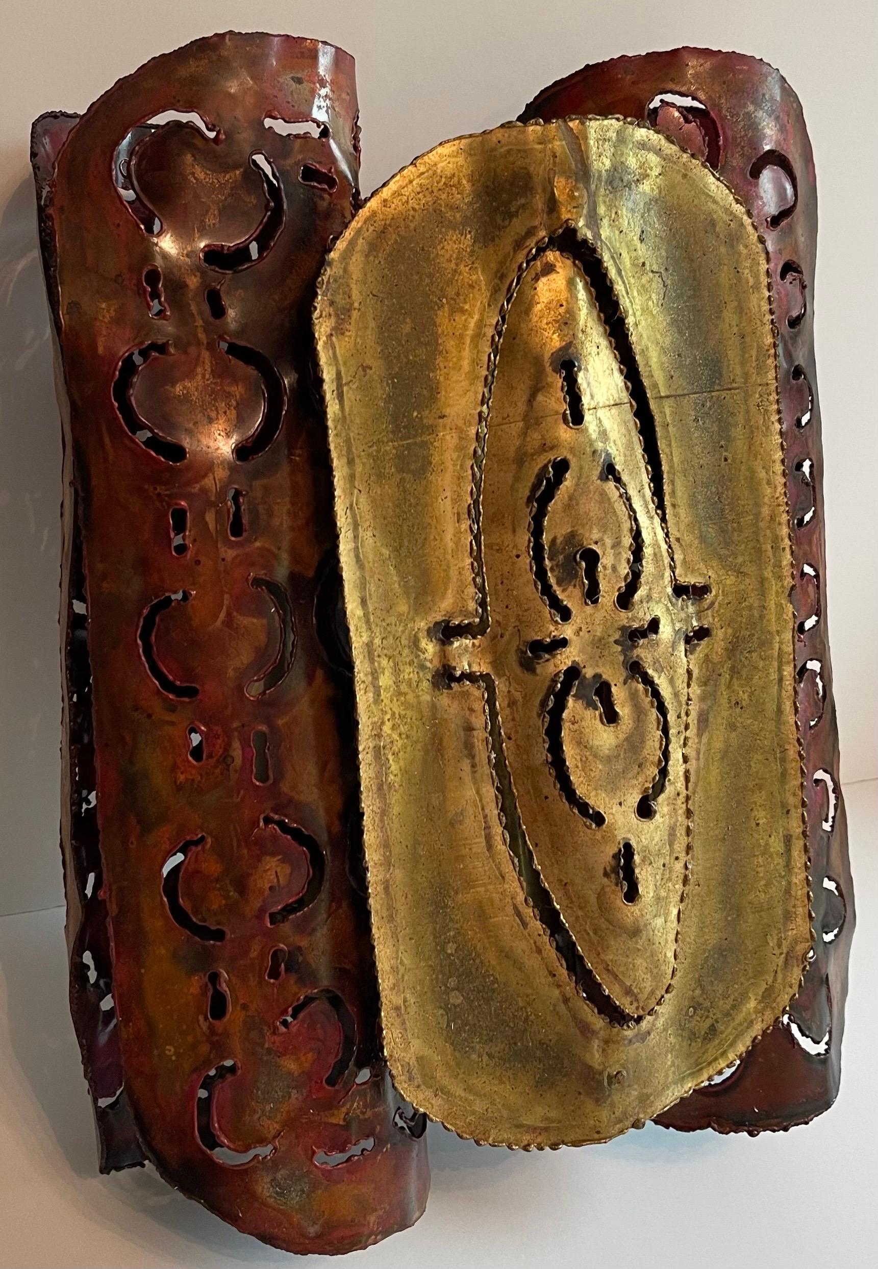 1970s brutalist two tone metal sconce. Burnished copper/brass metal finish.
Newly rewired with new sockets and new brass backplate. Takes two chandelier bulbs (not included).