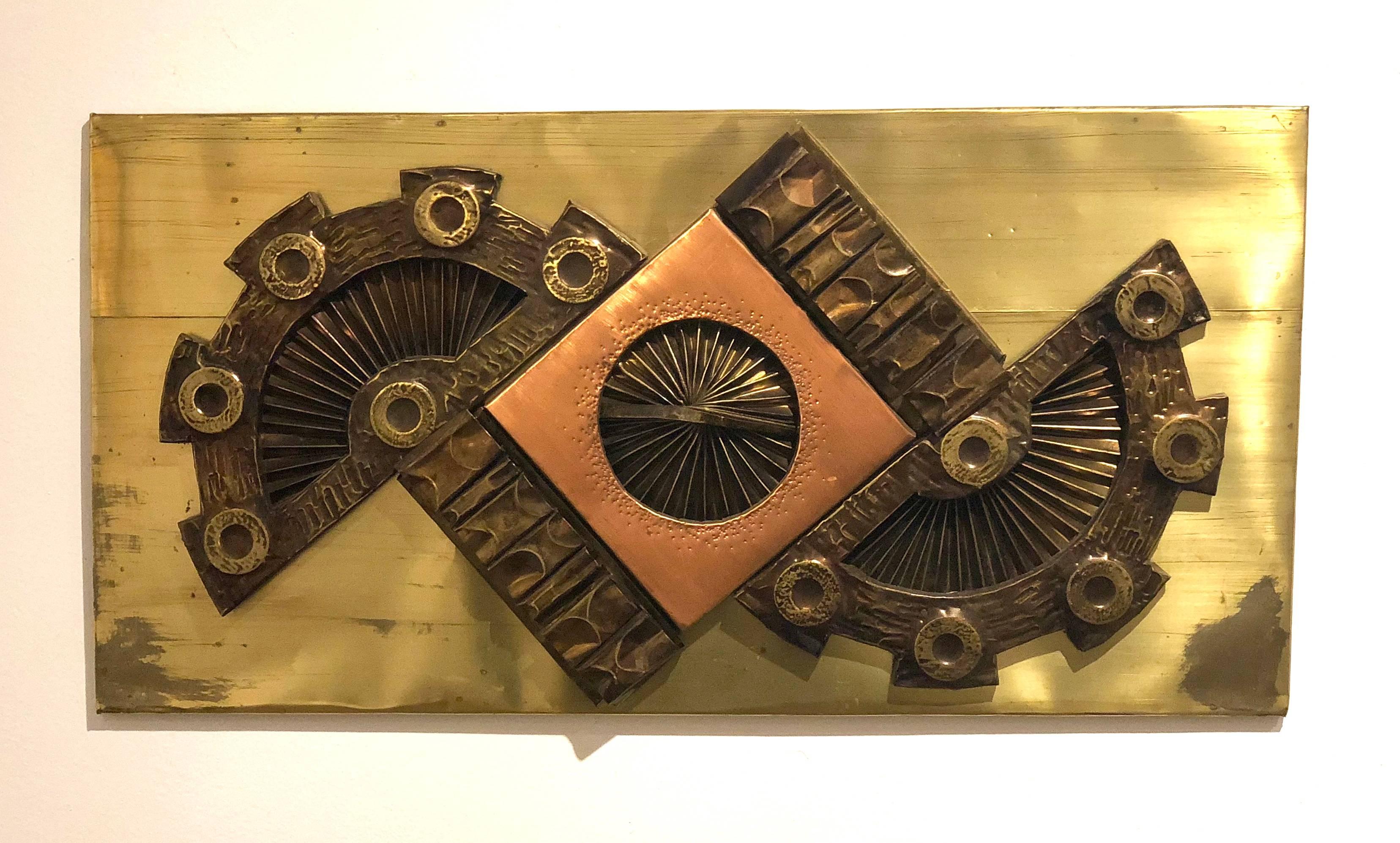 A very interesting wall hanging, brutal style patinated brass foil wrapped around plywood with brass and copper patinated shapes, circa 1970s all original condition by American artist Stephen Chun.