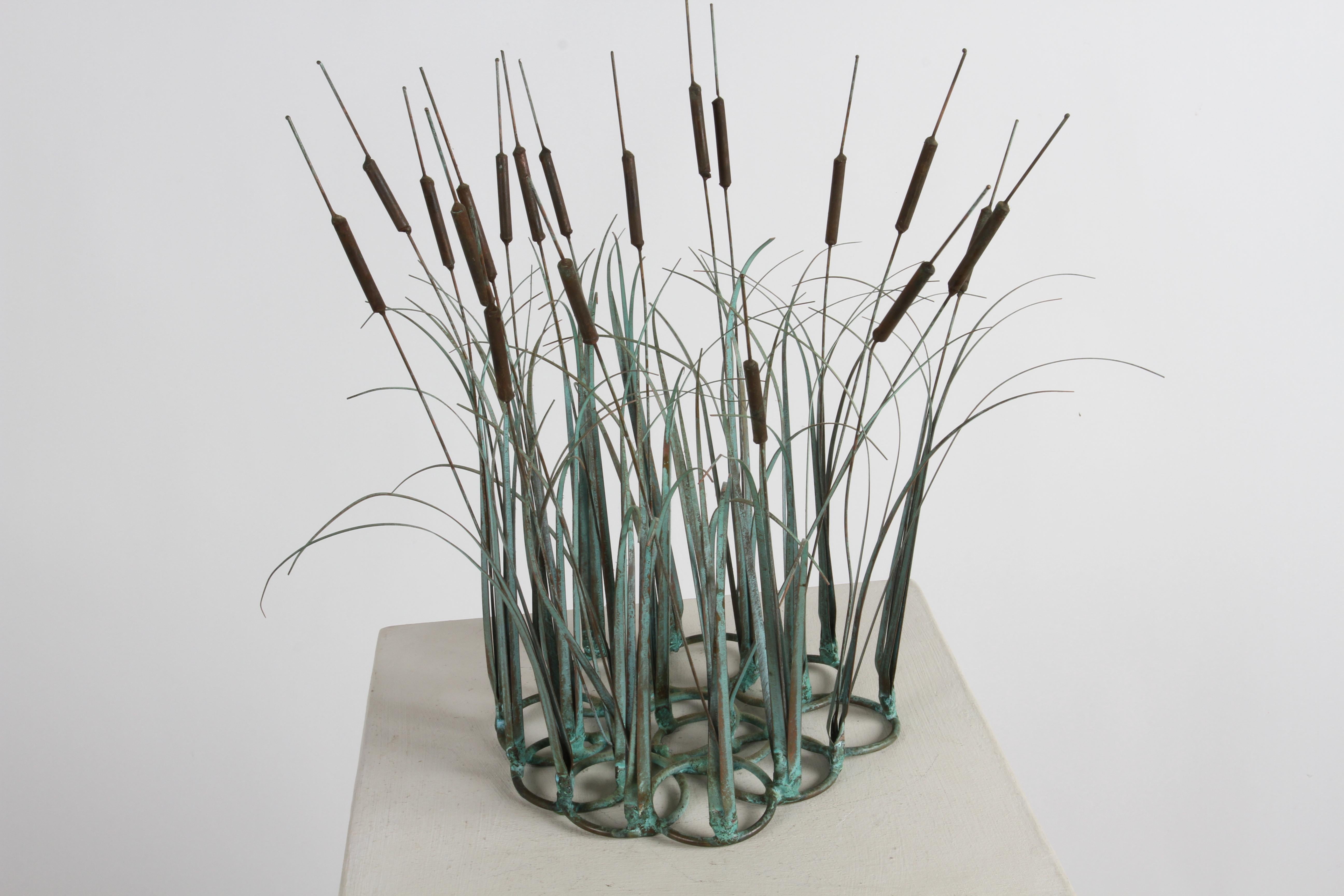 1970s Mid-Century Modern artisan made bronze and copper kinetic cattail and grasses sculpture with applied patina. Great sculpture for the coffee table, desk or as a centerpiece or more. In fine condition. 

In the style of C. Jeré. or Artisan