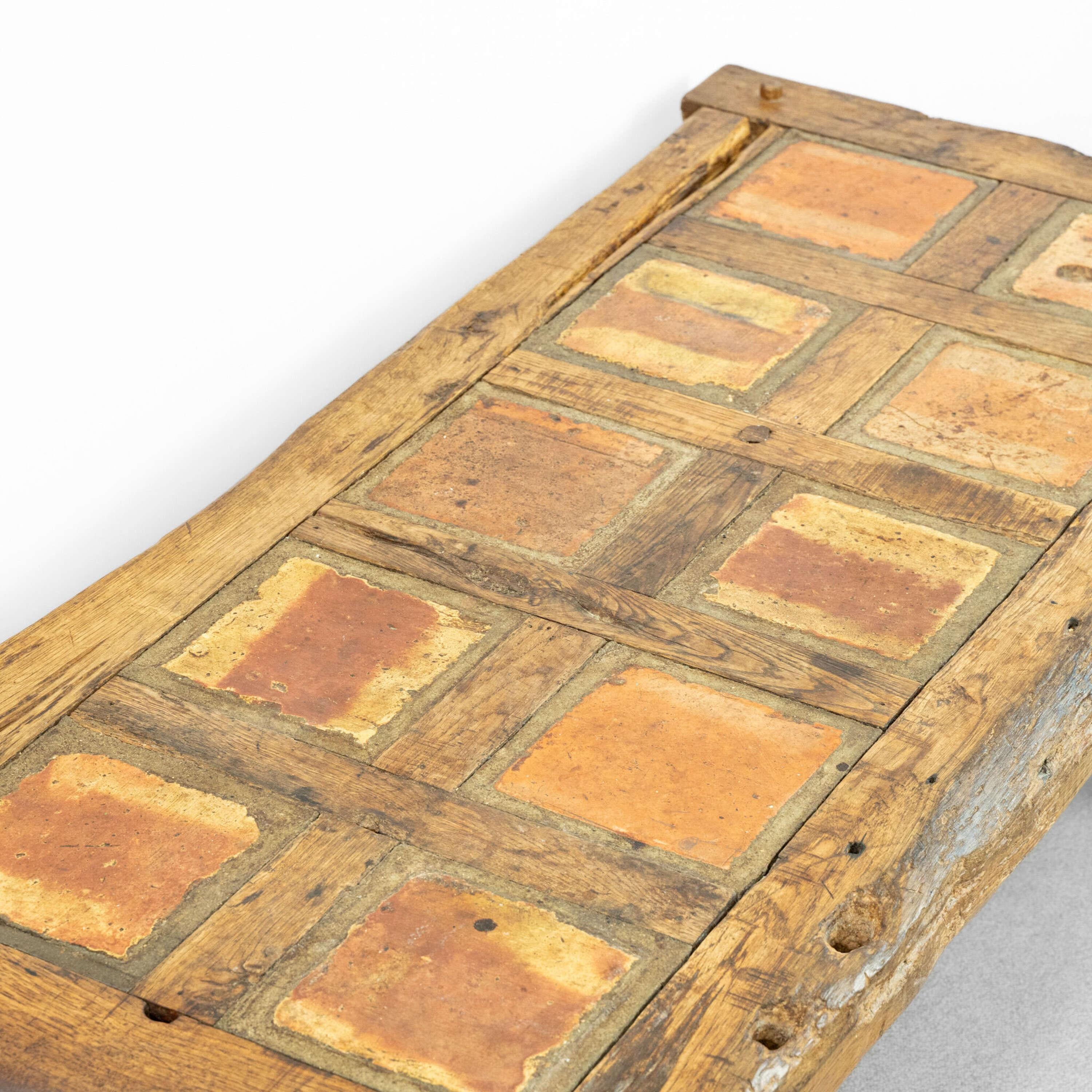 A Brutalist Coffee Table by Maison De Tonge.
Inlaid ceramic tiles into oak frame, with pegged joints. 
France, circa 1970.
Length - 139 cm
Height - 50 cm
Depth - 69 cm

Please message if any further info or photos are required 
SHIPPING
The quotes