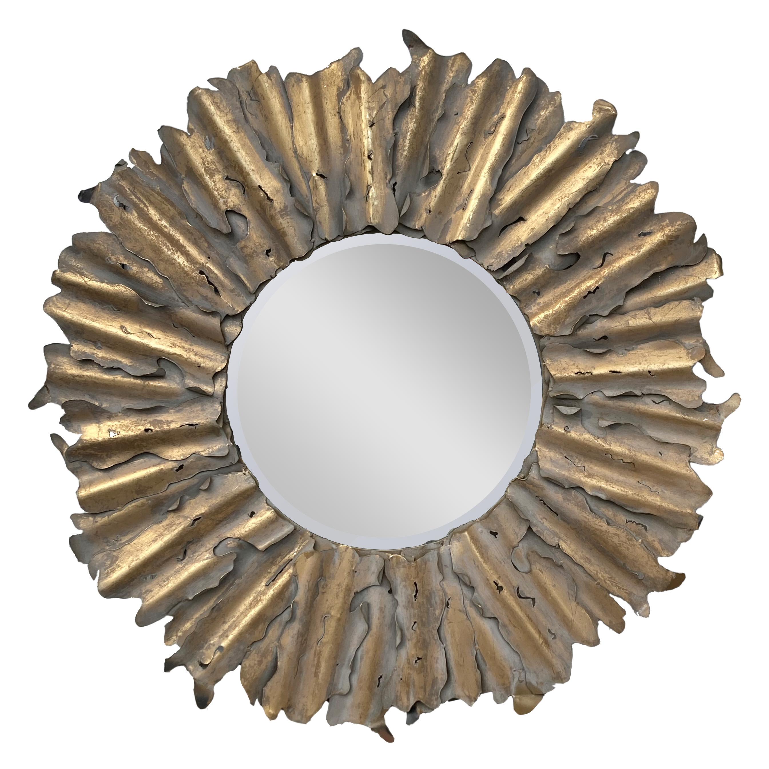 Super-cool torch-cut steel sunburst mirror in the Brutalist style.  An unusual find, the cut steel has been gilded, then surfaced with a whitewash, which was then rubbed through to the gilding.  It is very 