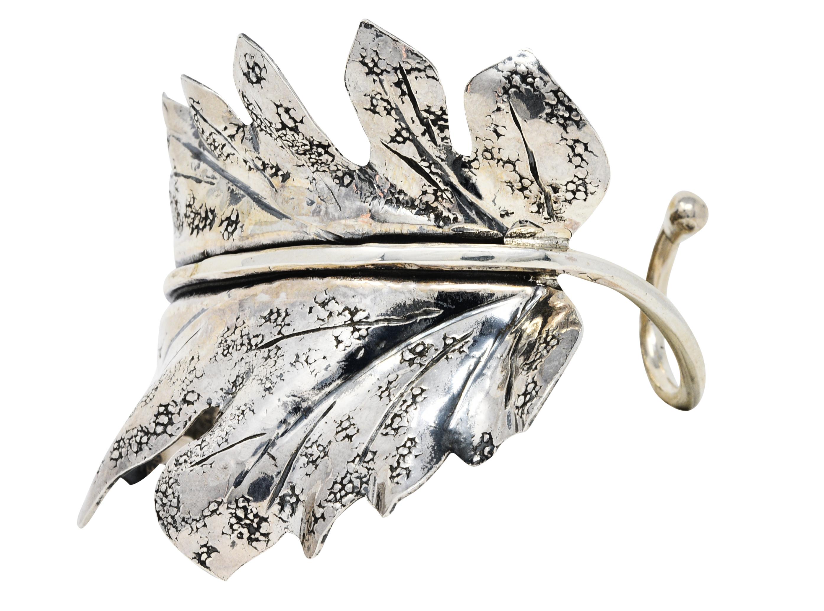 Large cuff bracelet is designed as a curved tomato leaf

Texturous with deep veining

Stamped Italy with Italian assay marks for sterling silver

Signed Buccellati

From the vintage Prestigi collection - circa 1970s

Prestigi designs are derived