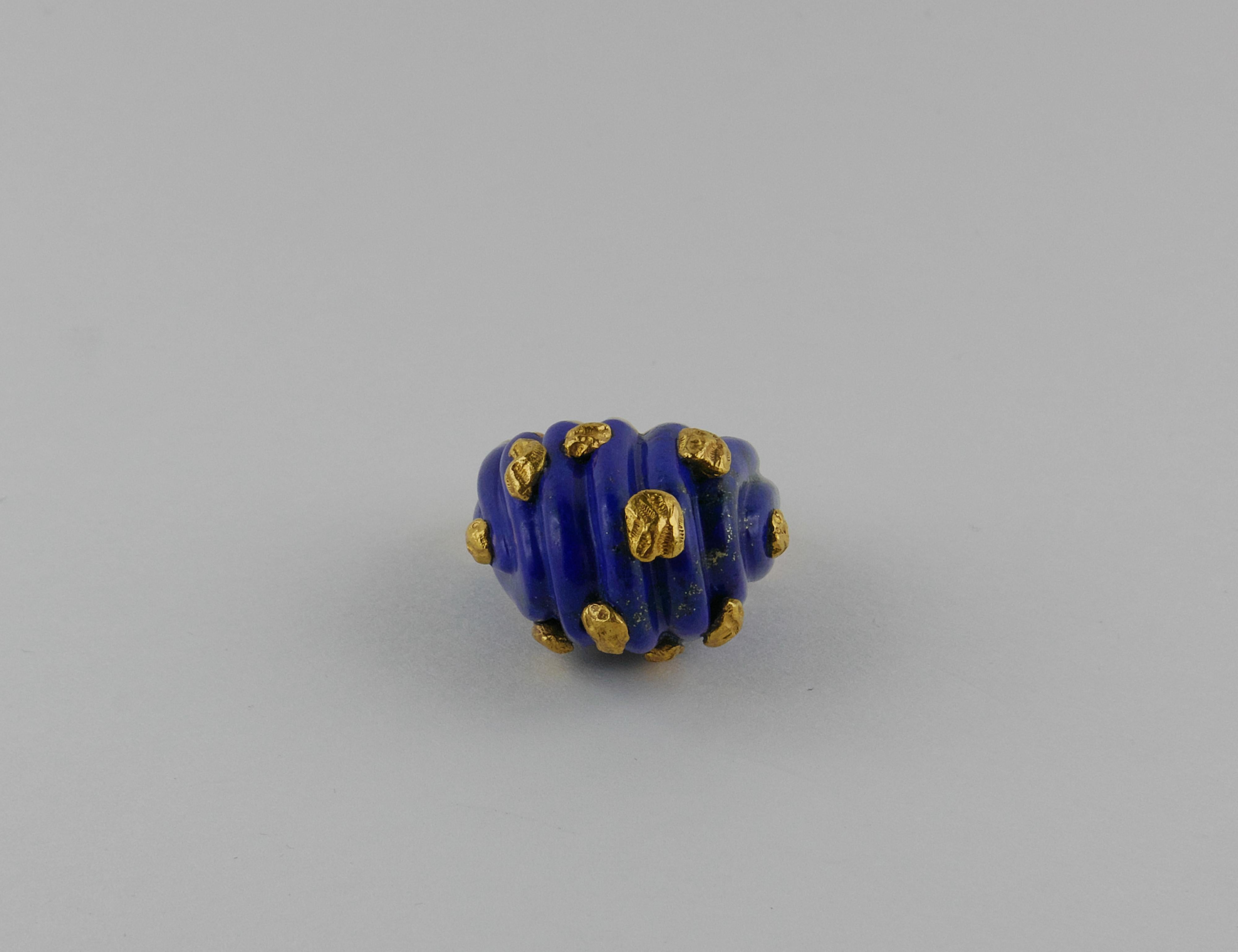 Extremely elegant Bucherer  cocktail Ring finely crafted in Switzerland in 1970s in rich 18 karat polished Yellow Gold and Lapis Lazuli.  This stylish Ring features a high Lapis Lazuli with  golden specks of pyrite Dome, rising  1.5 cm from the