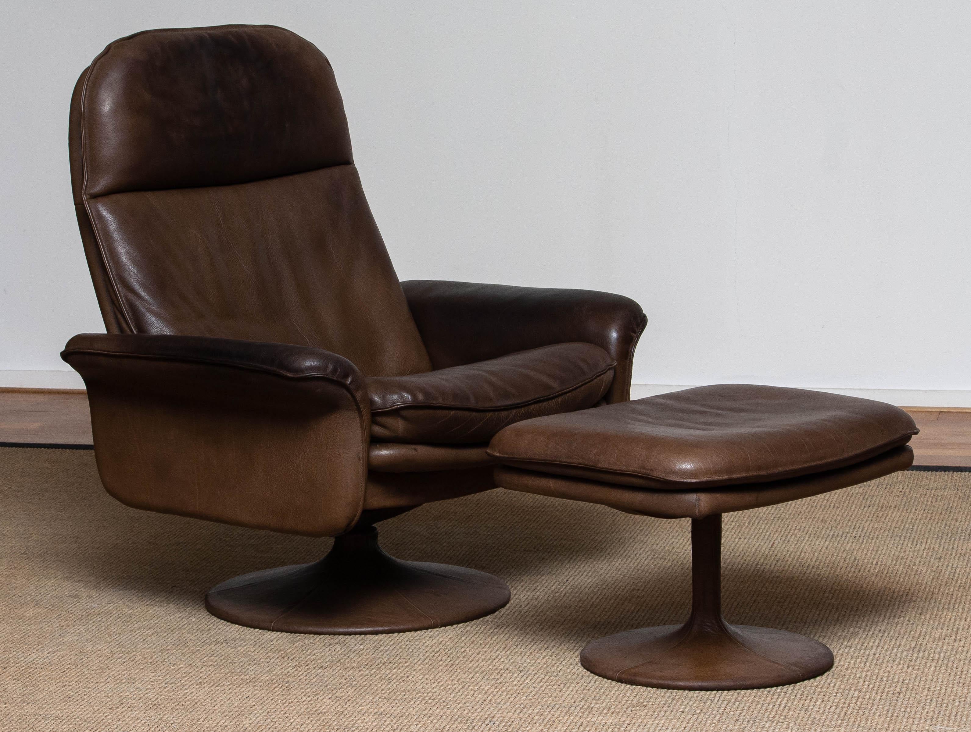 Brutalist 1970's Buffalo Leather Swivel and Relax Chair with Matching Ottoman by De Sede